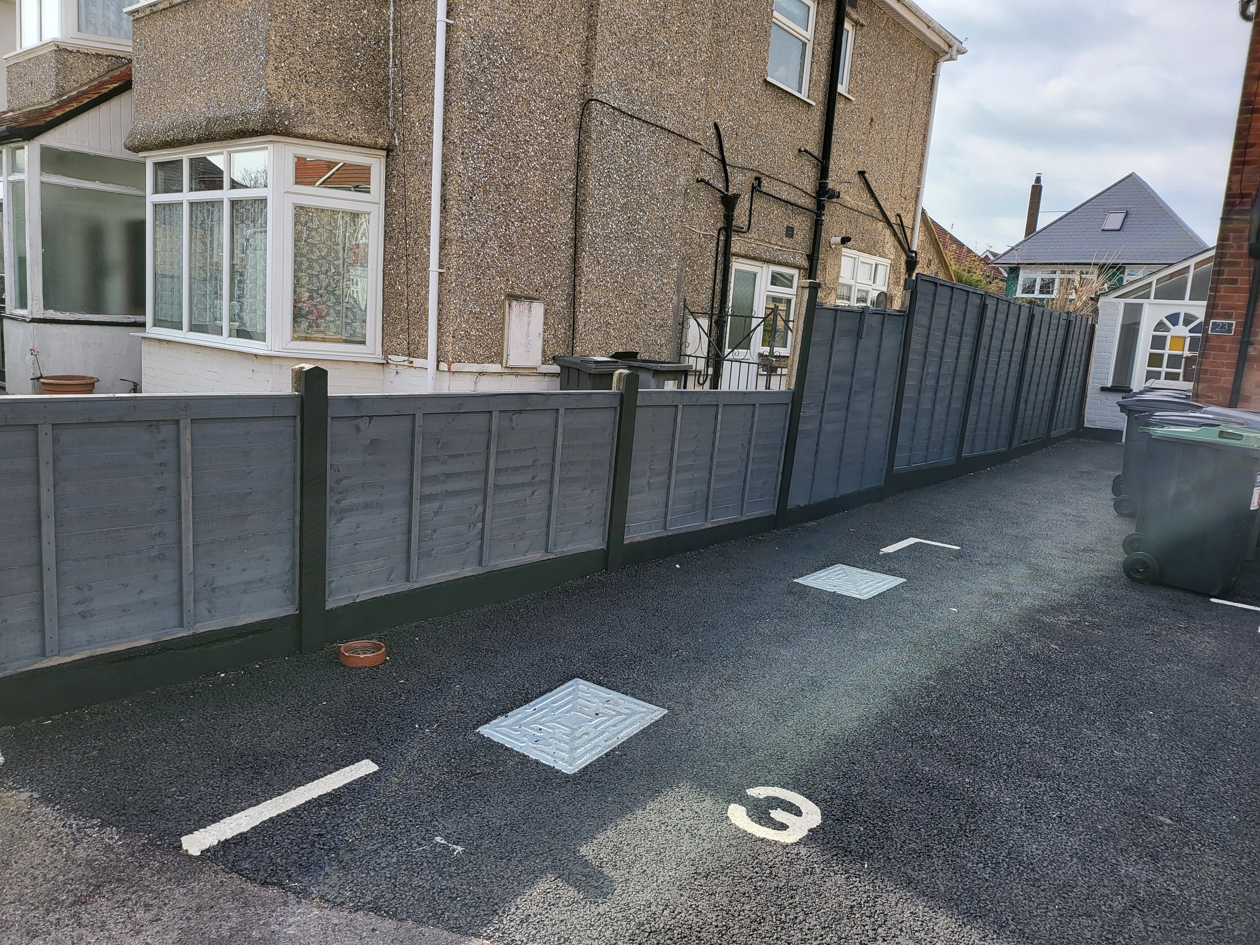 Painting old fencing, posts and plinths to freshen up look