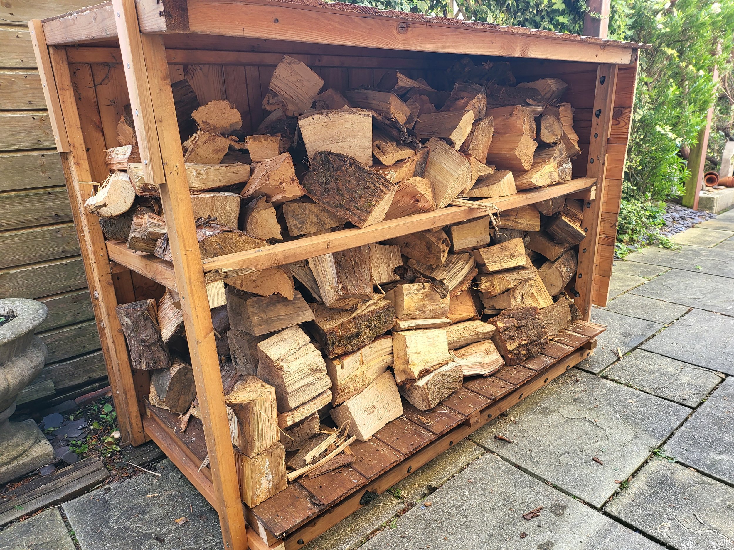 Wood store made from remnants of old garden shed!
