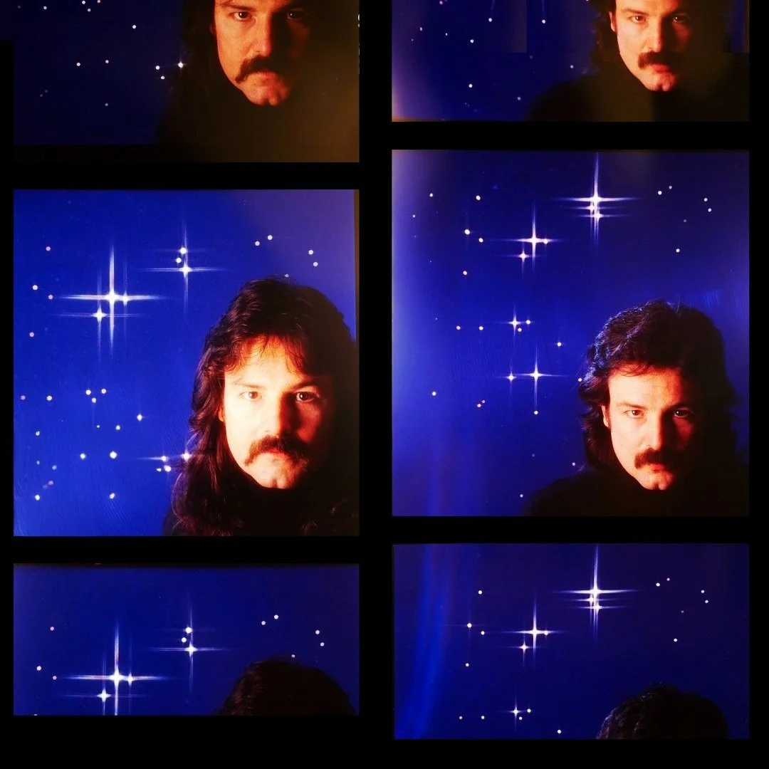 At the time we shot the cover for Plus Signs, my hair was pretty long. When I saw the first proofs I realized that it was time for a haircut and to trim the moustache. We re-shot the cover and the shorter hair is what you see on the cover.