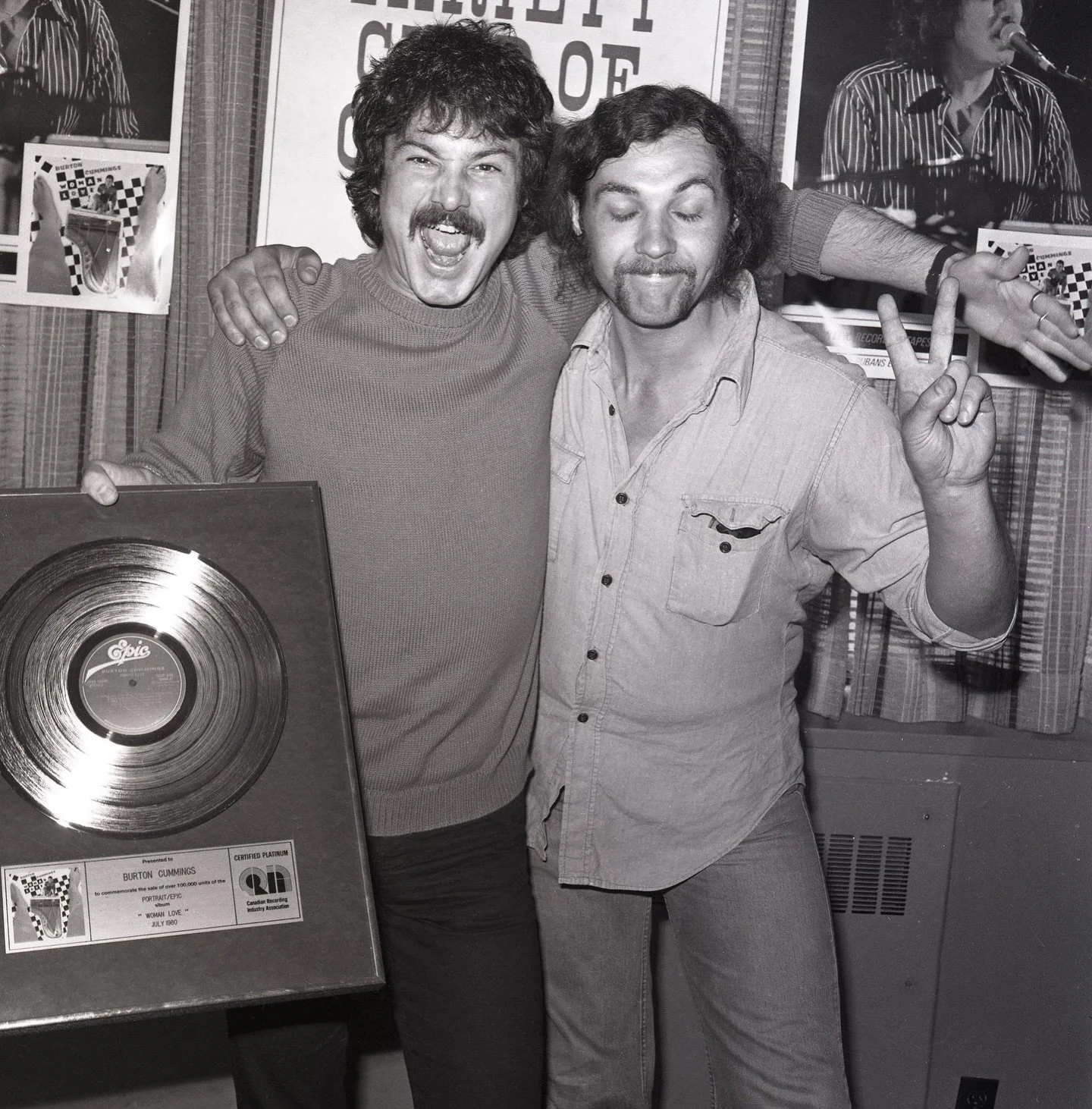 As we are preparing for the Nov 8th show at the El Mocambo in Toronto, I came across this photo taken in that venue celebrating Woman Love going platinum along with Reggie from security.