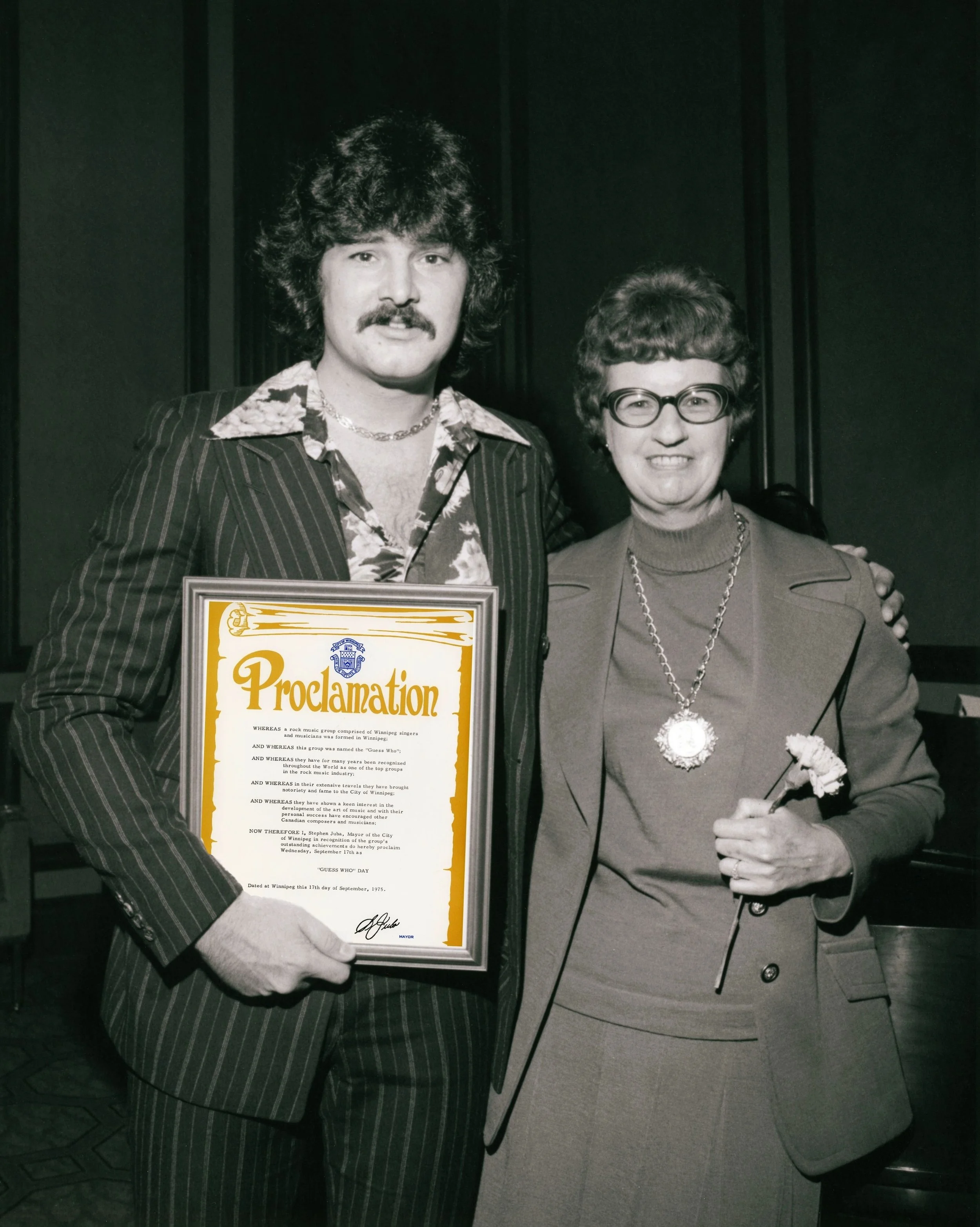 On September 17, 1975, Winnipeg Mayor Stephen Juba officially proclaimed the day &ldquo;Guess Who Day&rdquo; to honour the Guess Who. Word had gotten around that we were folding, which was officially announced later that month.

My mother attended wi