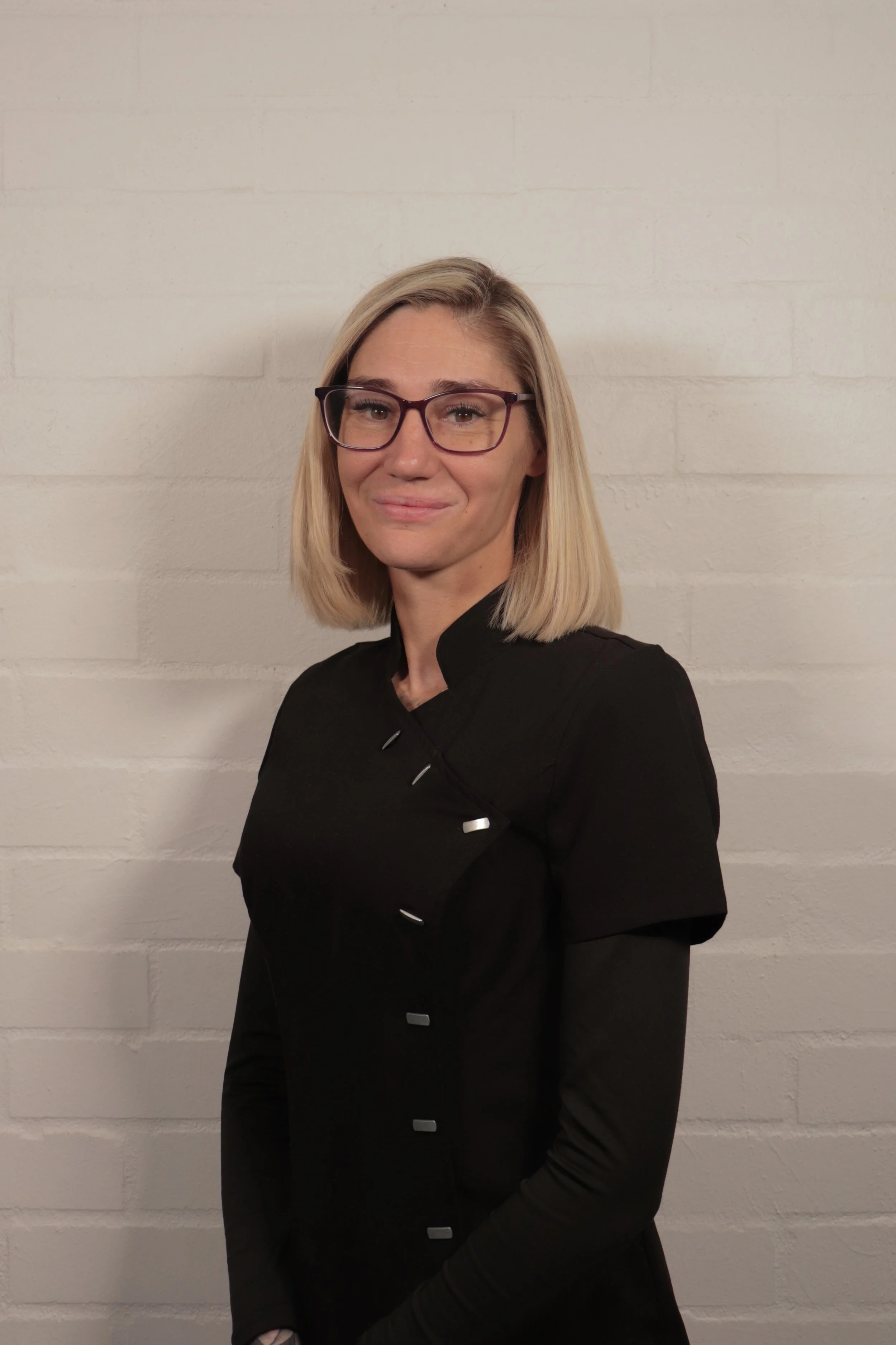 Headshot of Kris, the owner