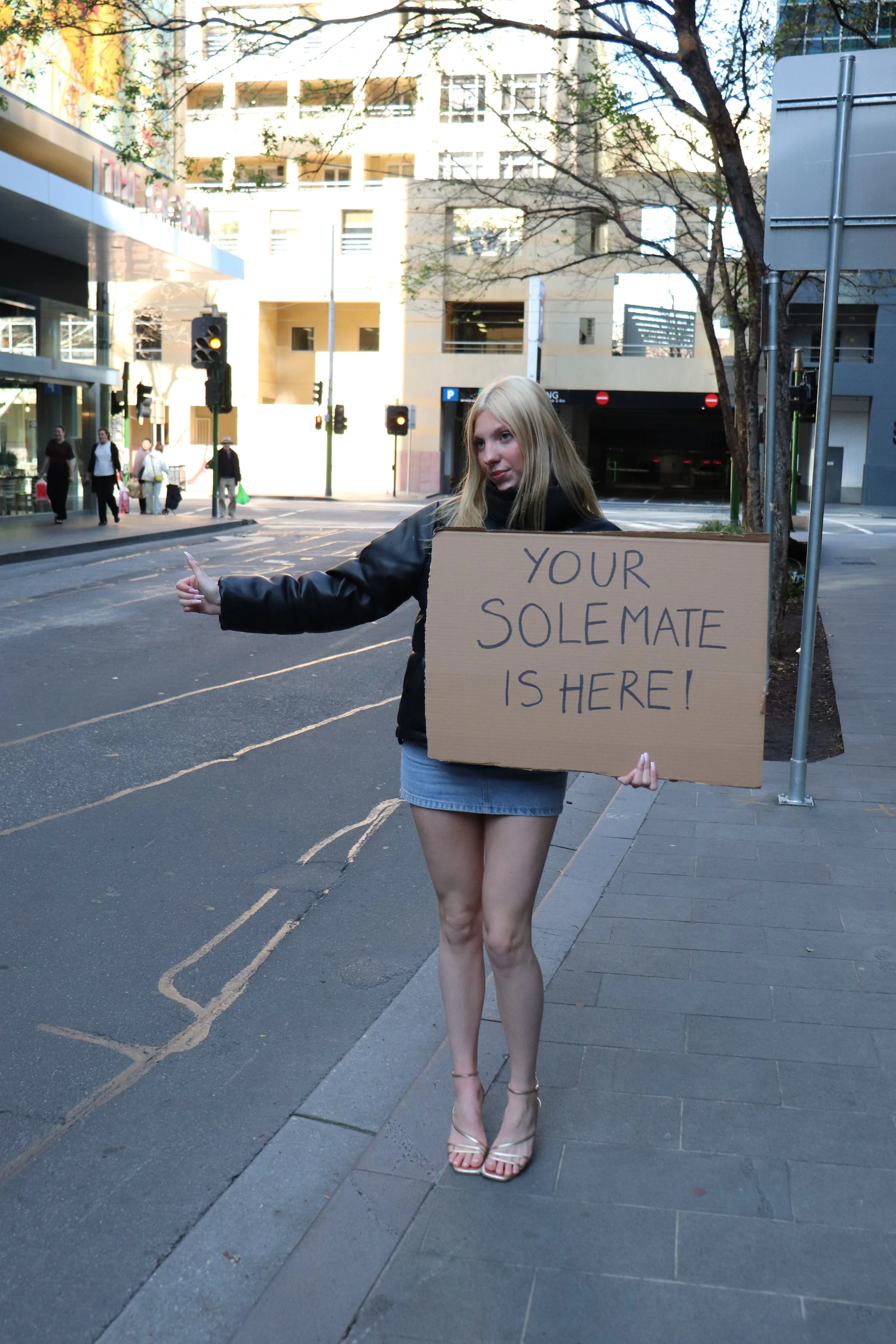Model standing with a sign