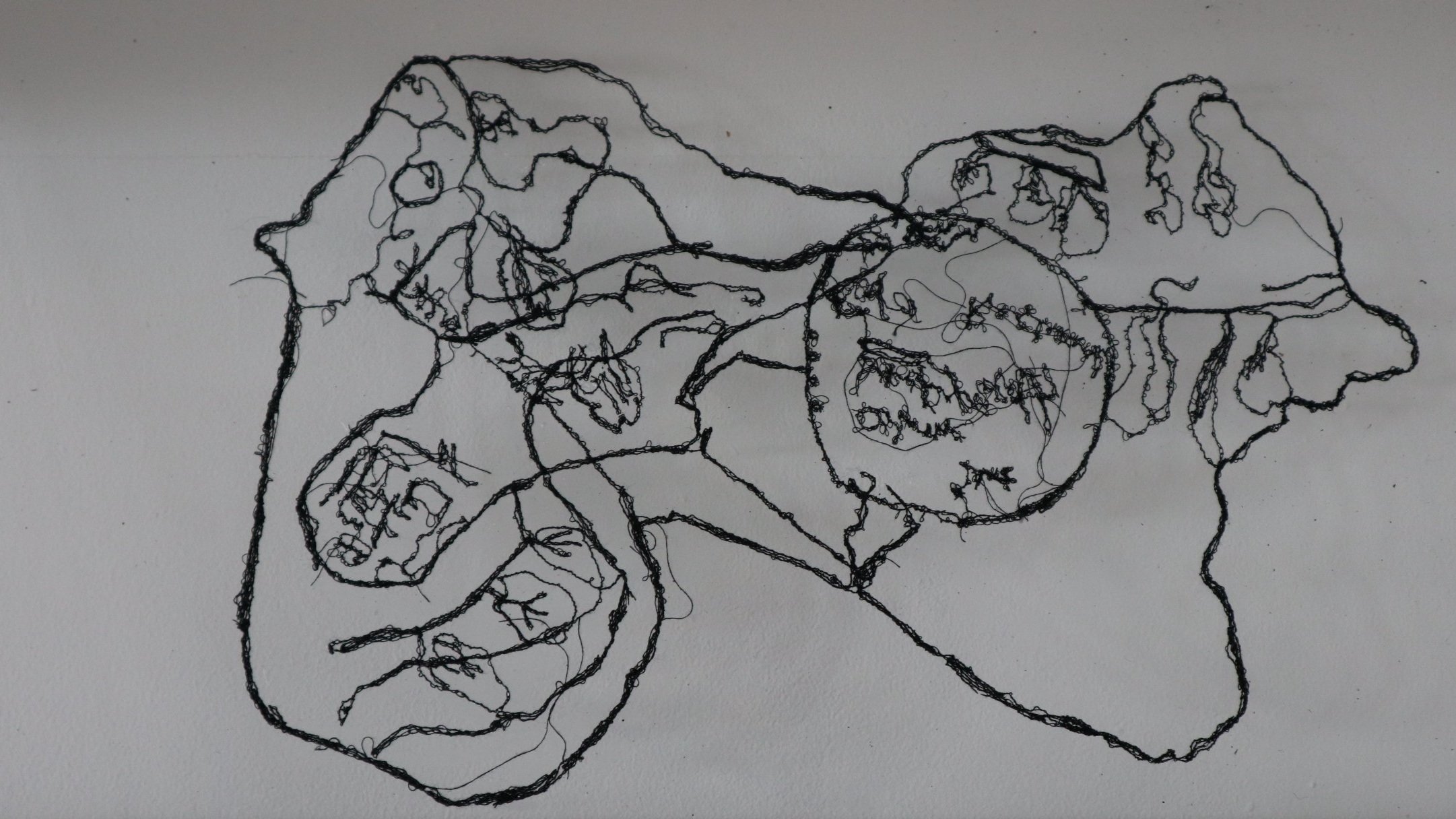 Black thread embroidered map.
