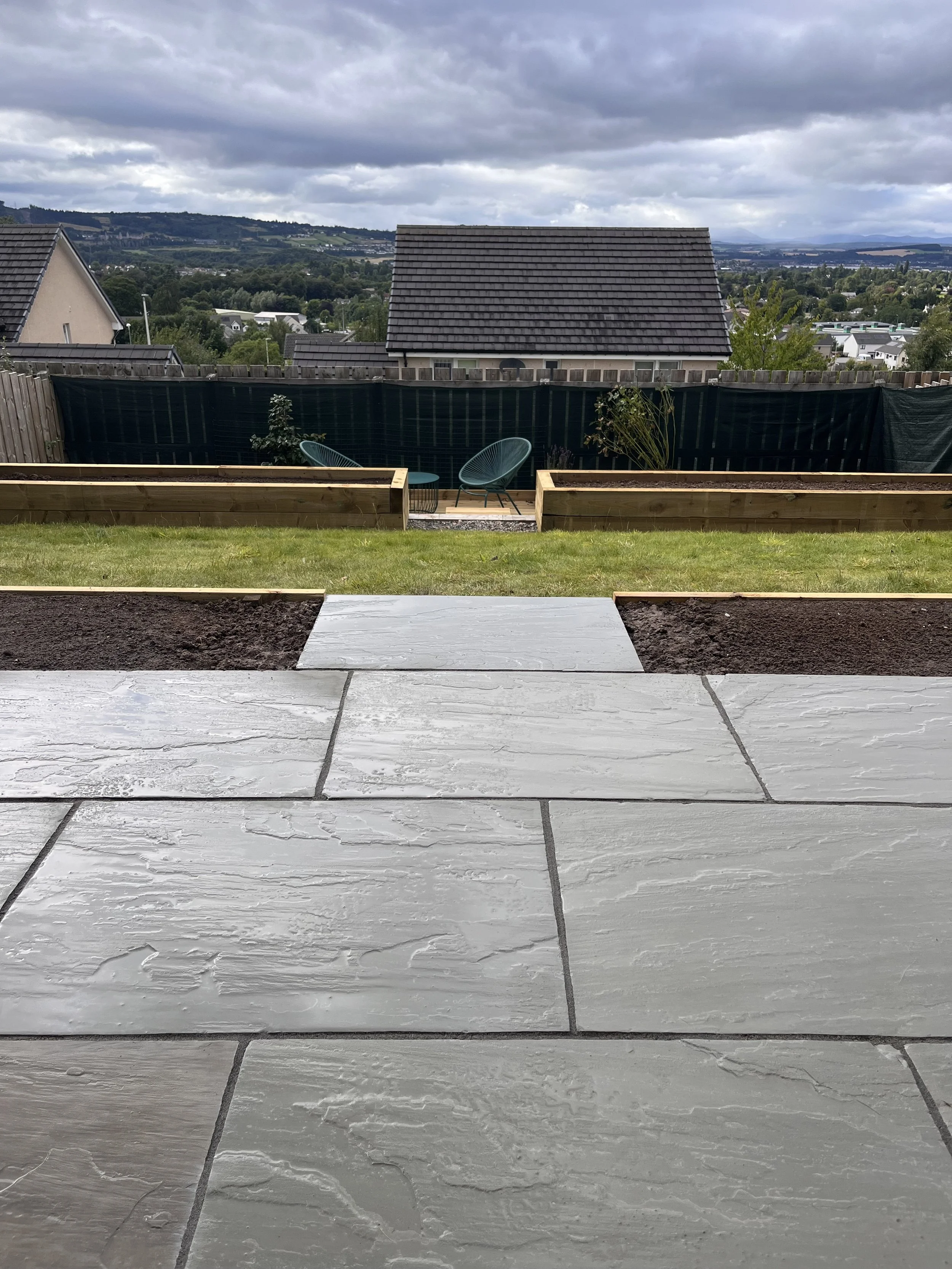 sandstone patio and raised planter beds