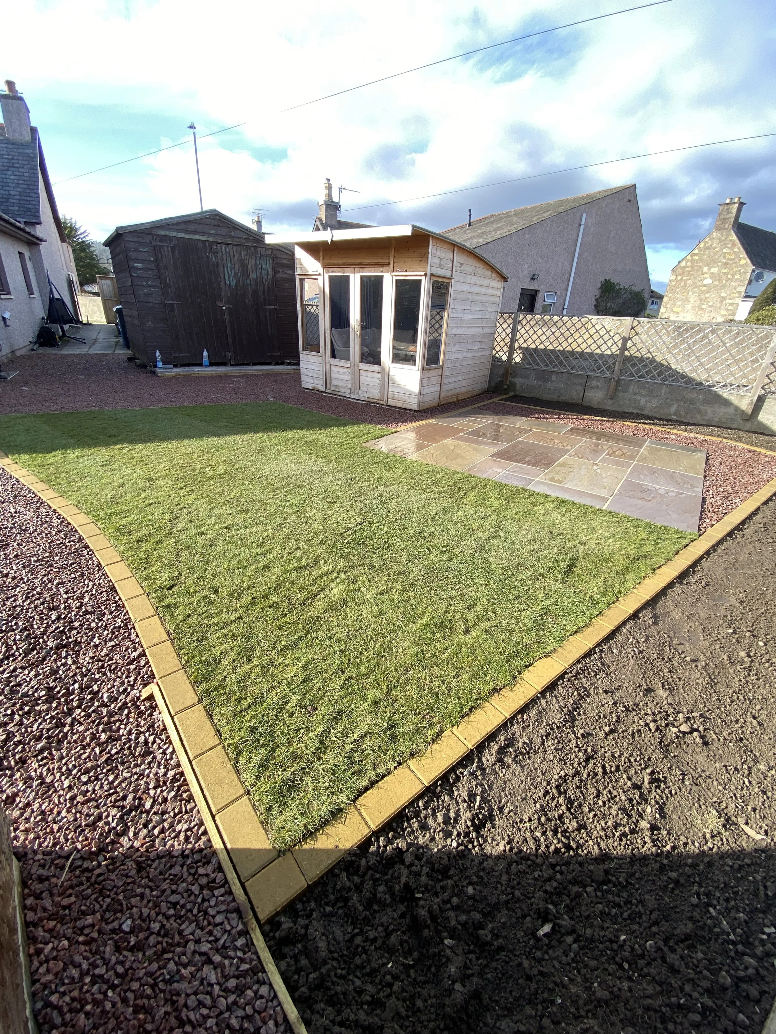sandstone patio with cobble border