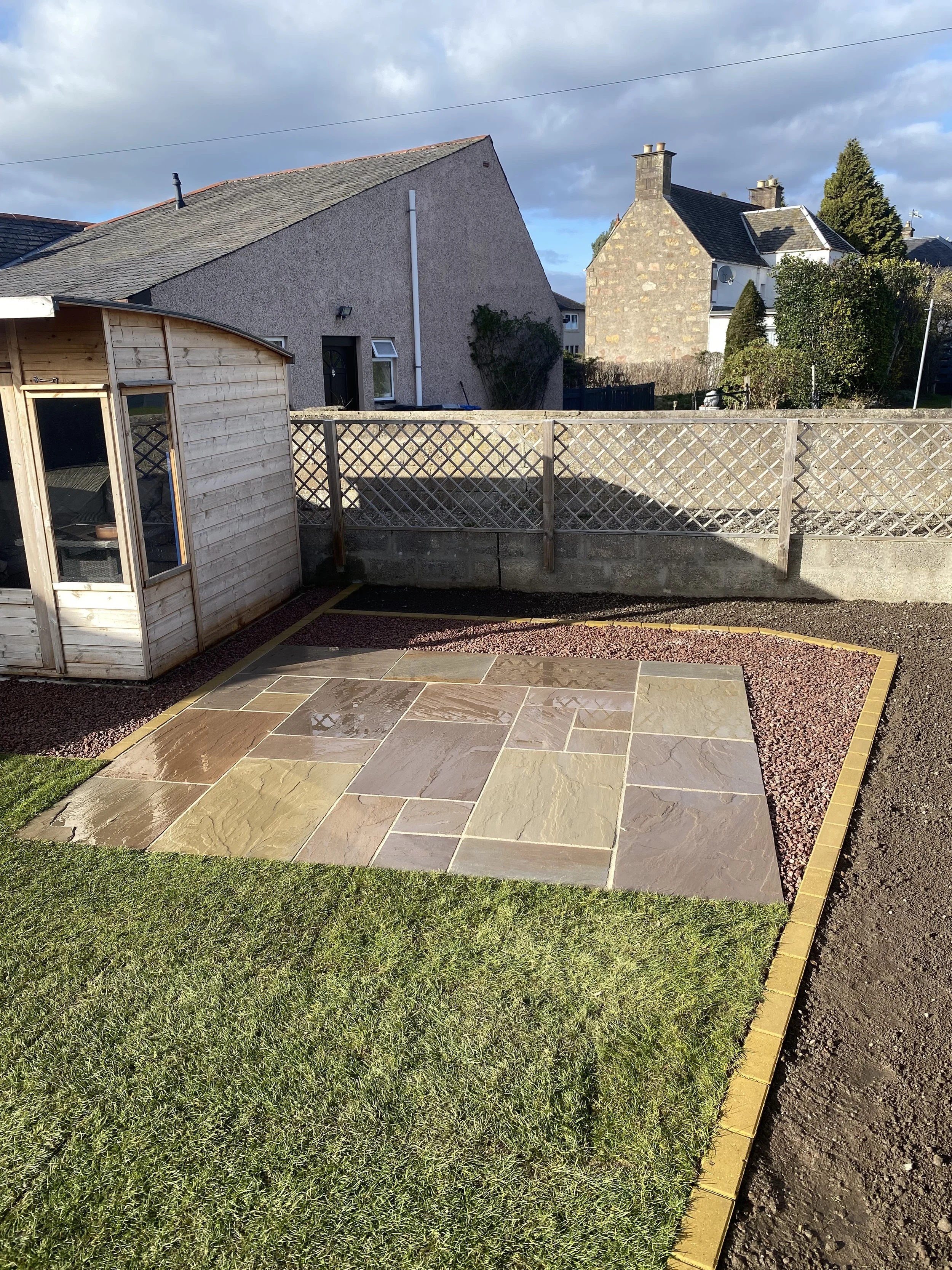 sandstone patio with cobble border