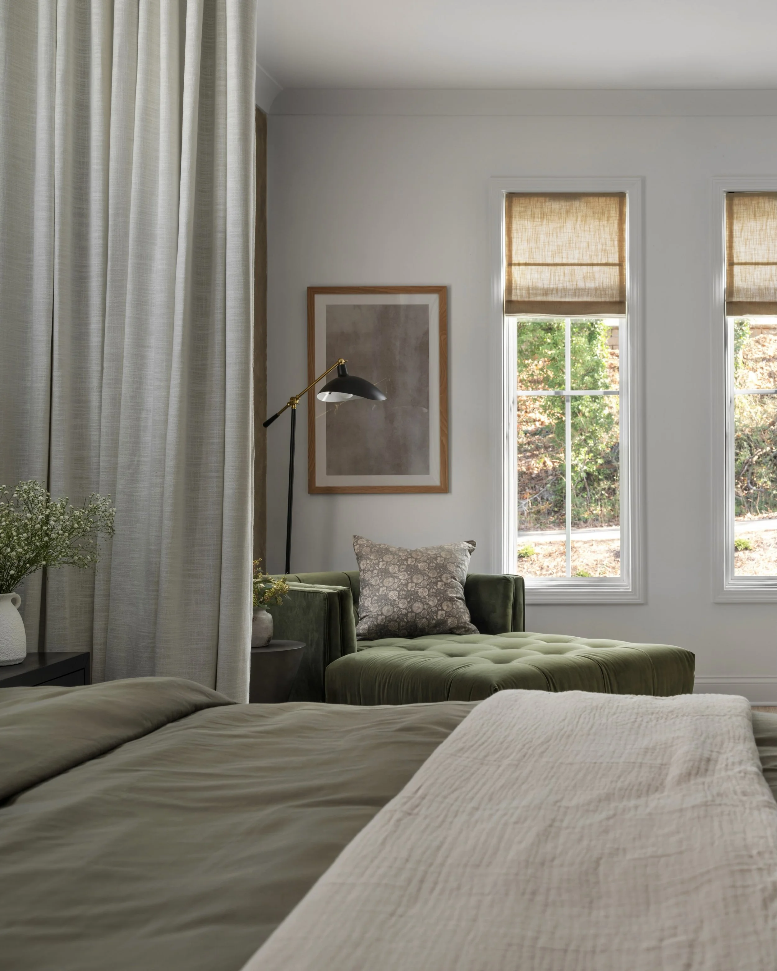 A finished sitting room that is reminder of why the details matter.

The softness of the floor to ceiling drapery, the warmth of the woven shades, the layered textiles, and the quiet green tones all work together to create a space that feels calm and