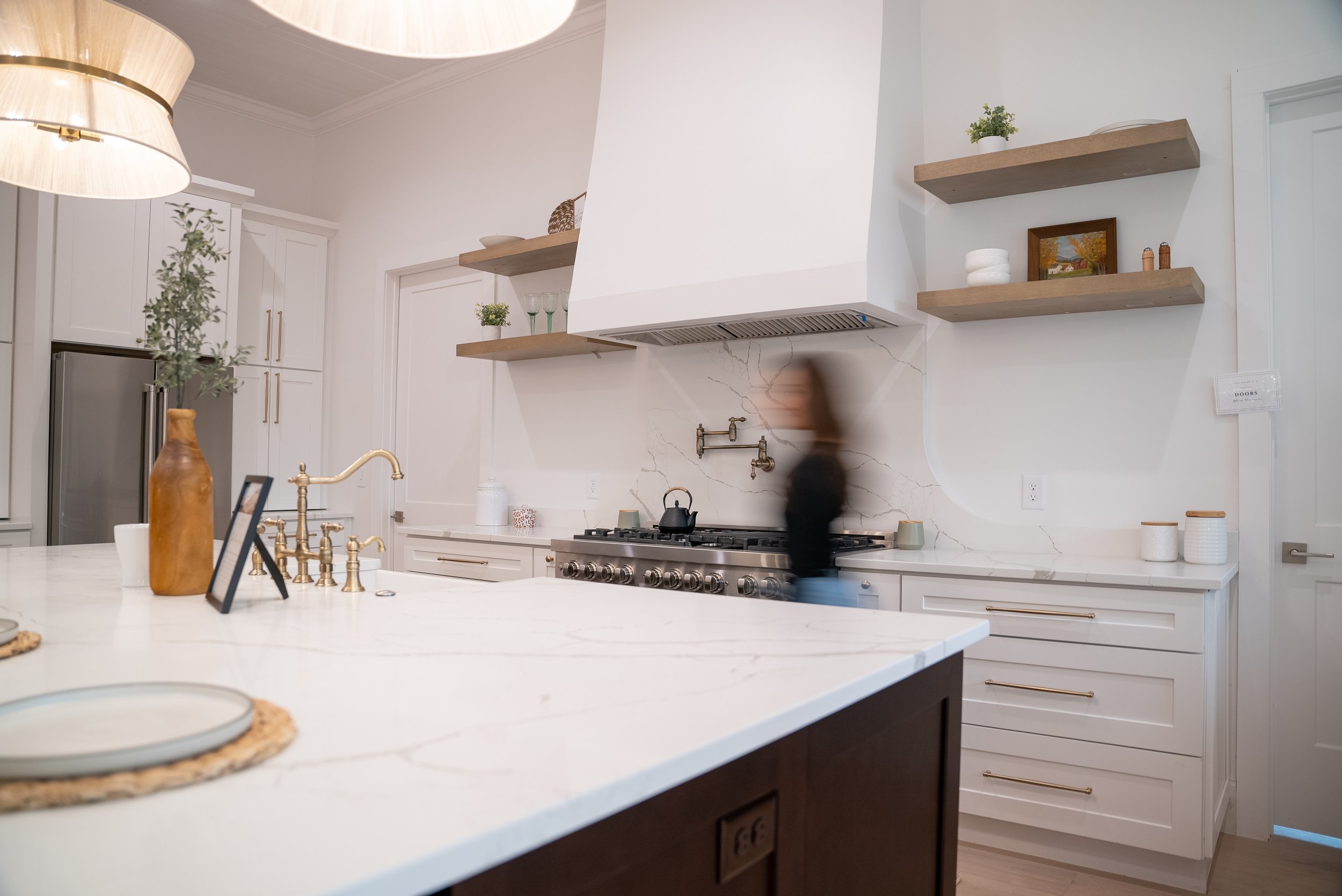 Interior Designer in Athens Ga walking through a luxury kitchen from a Georgia home project