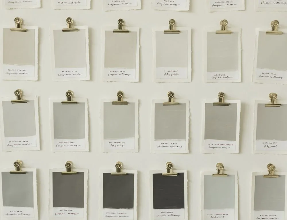 Neutral paint swatches on wall for testing