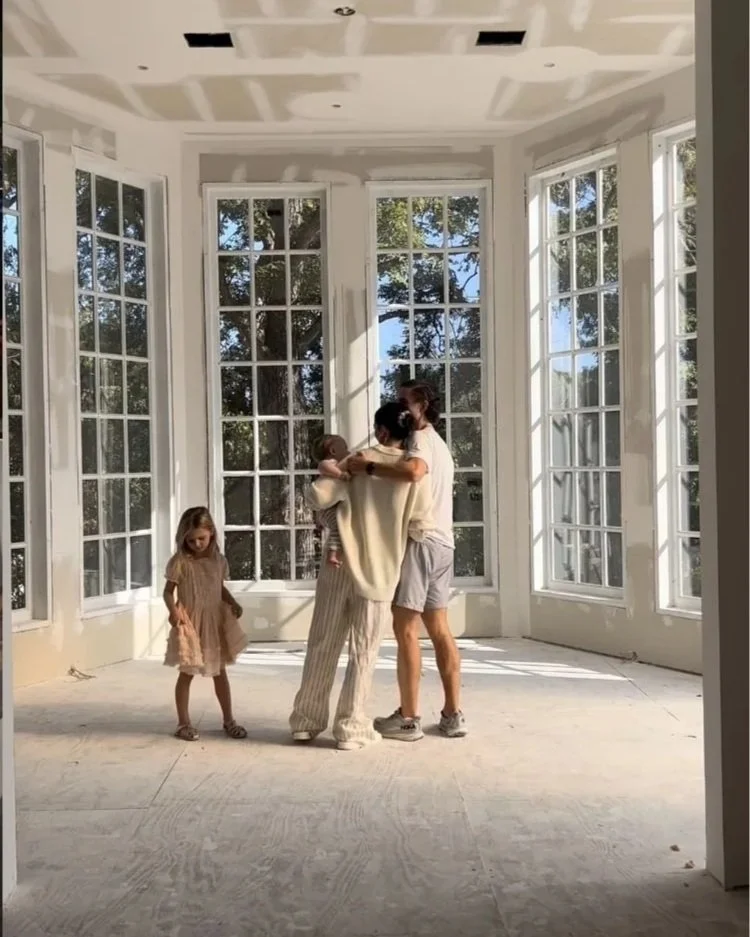 Family Inside Forever Home at Drywall Stage
