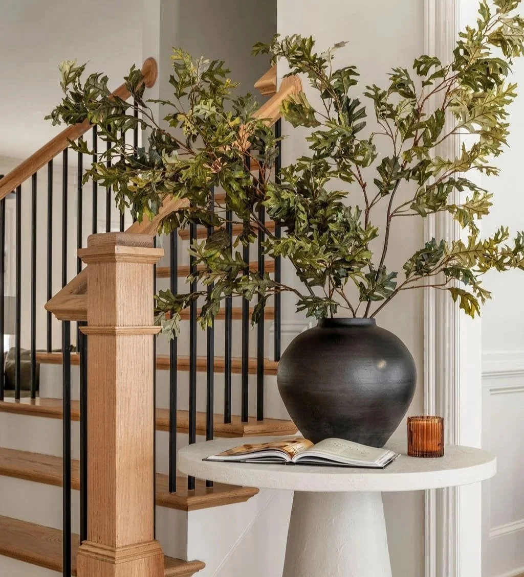 Modern Organic Home Design Vignette of Entrywat table with stairway behind