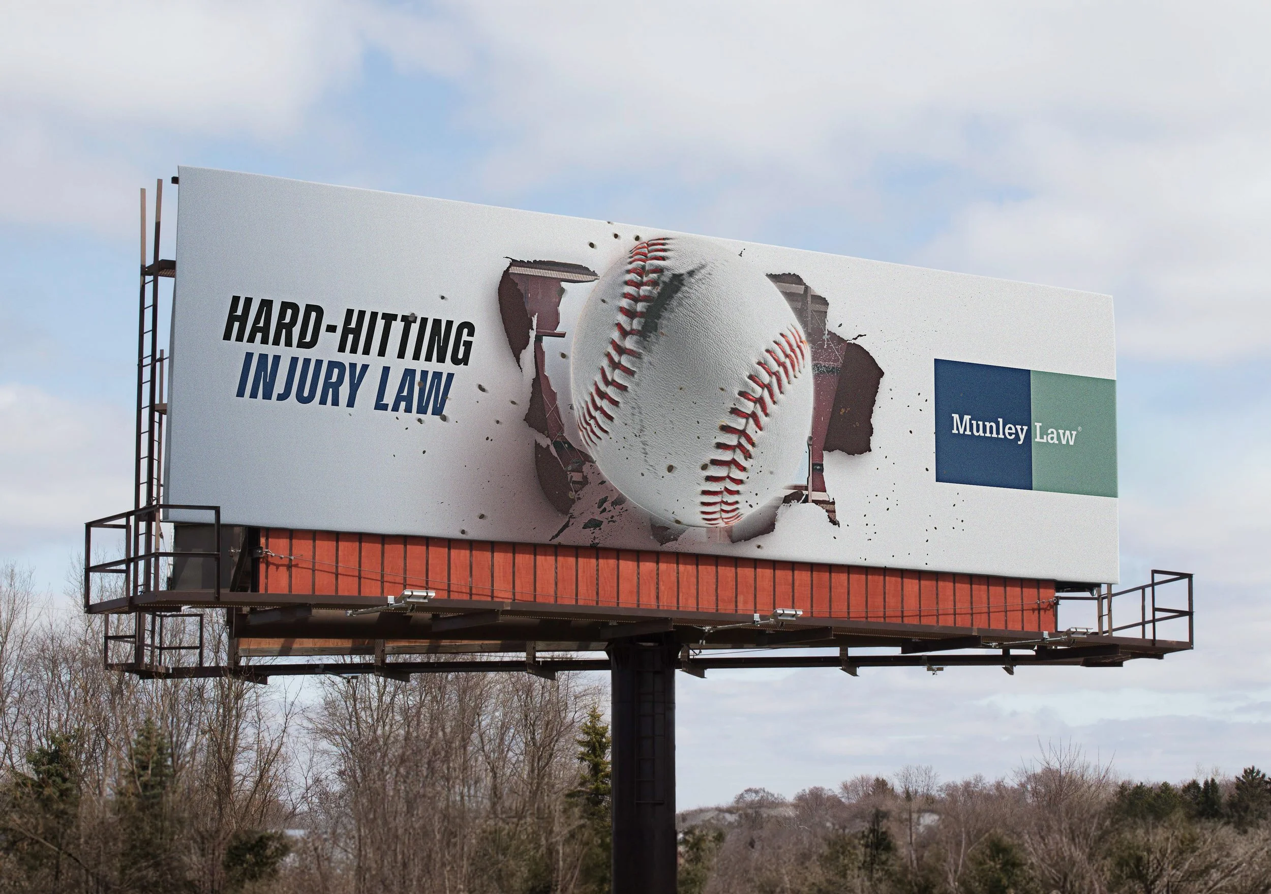 Billboard with a torn poster revealing a baseball and the text 'Hard-Hitting Injury Law' and 'Munley Law'