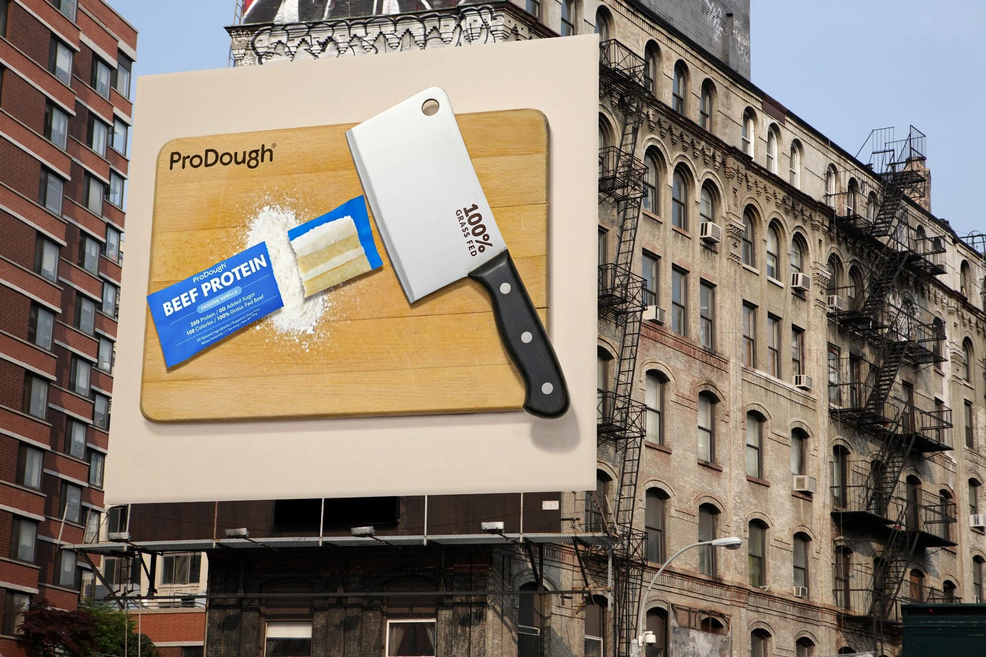 ProDough Beef Protein packet cleaved in half on a butcher's block with a cleaver on a large format wallscape billboard.