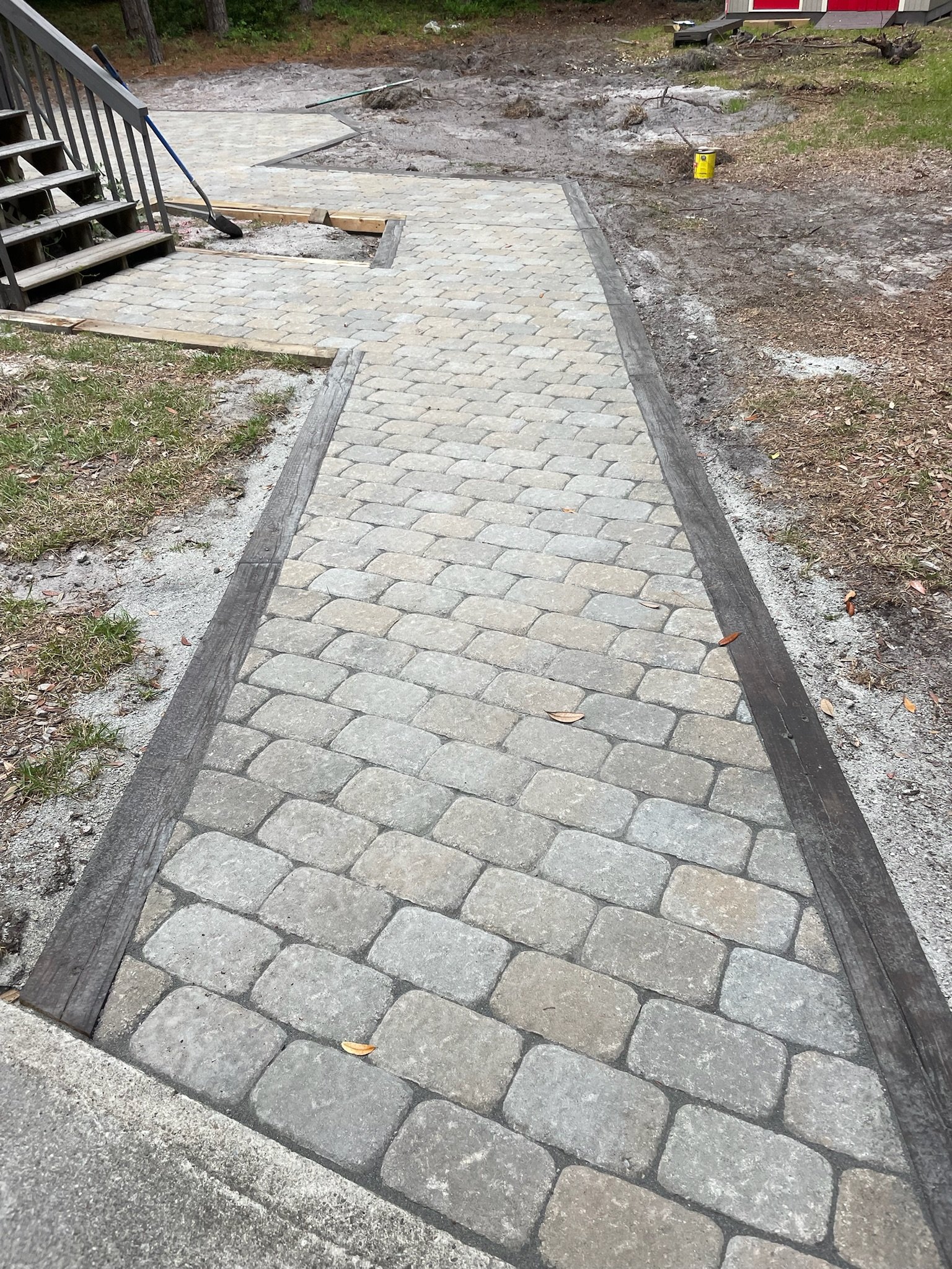 Stone paver walkway with stair access