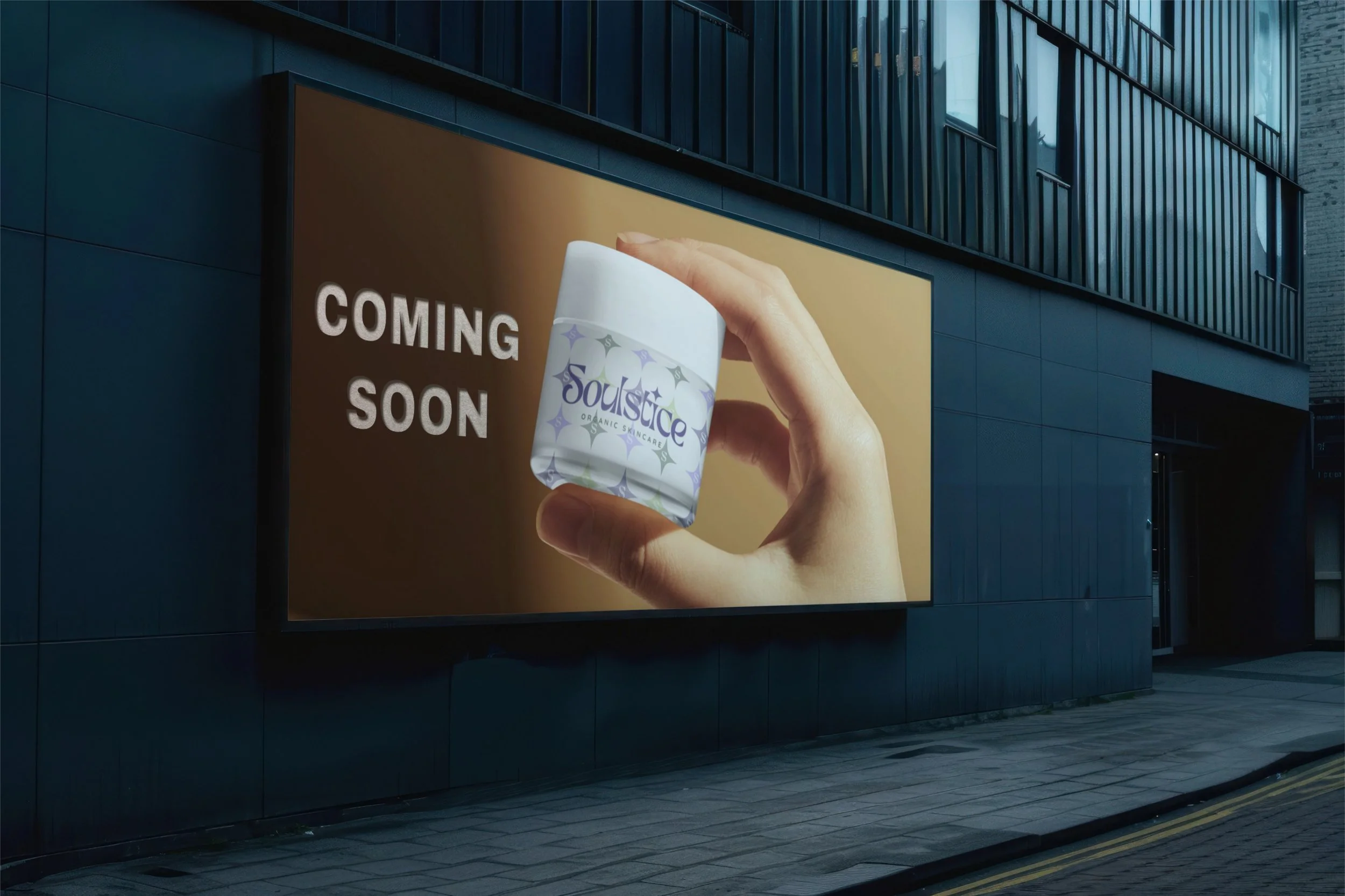 Digital billboard displaying an advertisement for Soulstice Organic Skincare, with a hand holding a white jar labeled Soulstice, and the text 'Coming Soon' on a brown background.