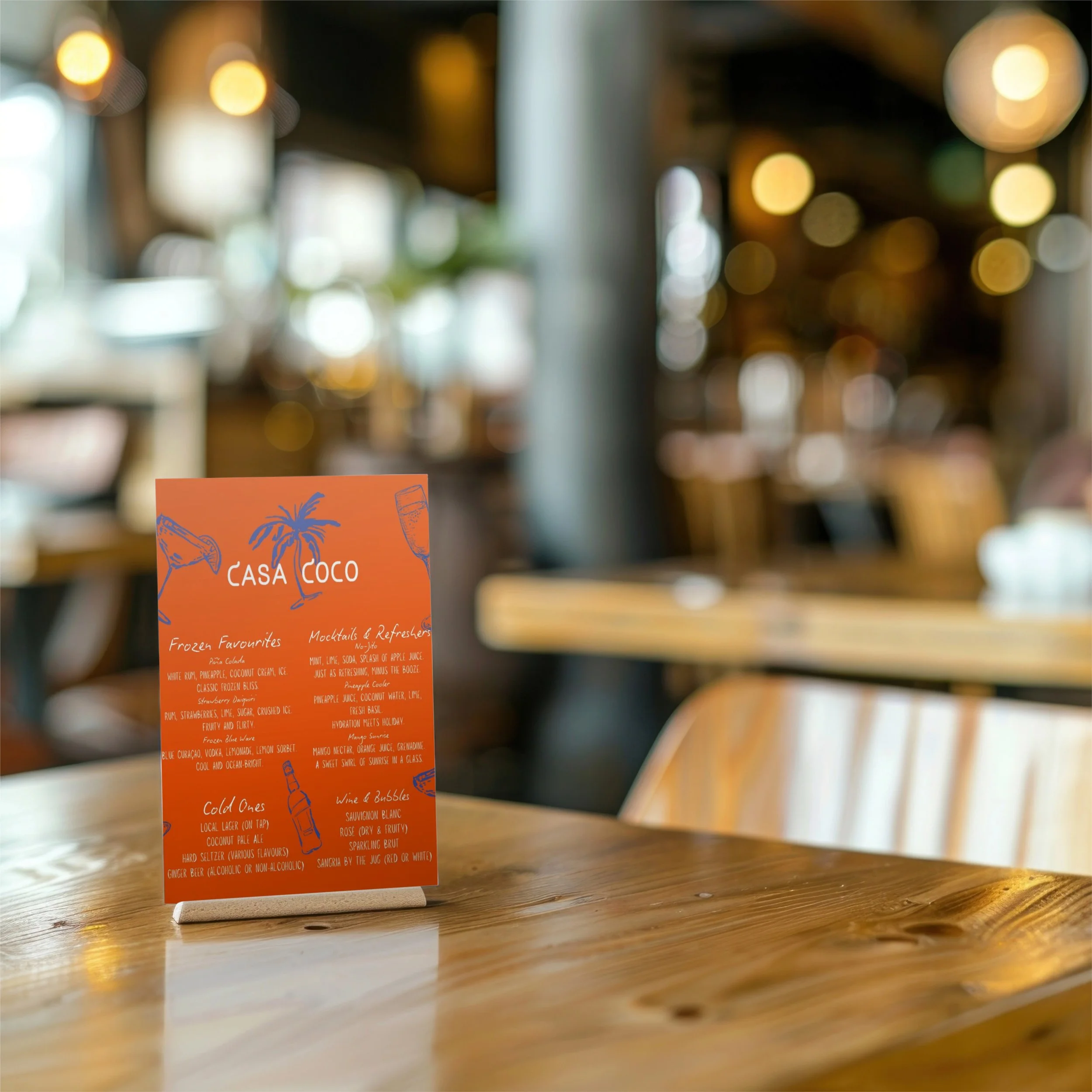 Menu card titled Casa Coco on a wooden table in a restaurant with blurred background and warm lighting.
