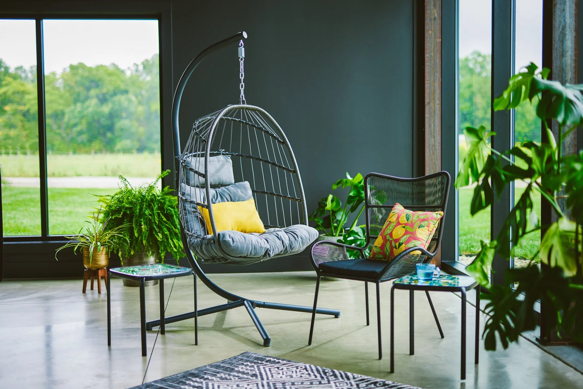 NicoleMiller_SteelRopeHangingChair_WingbackWickerChair_PatternStackingTables_0377-B0_web.jpg