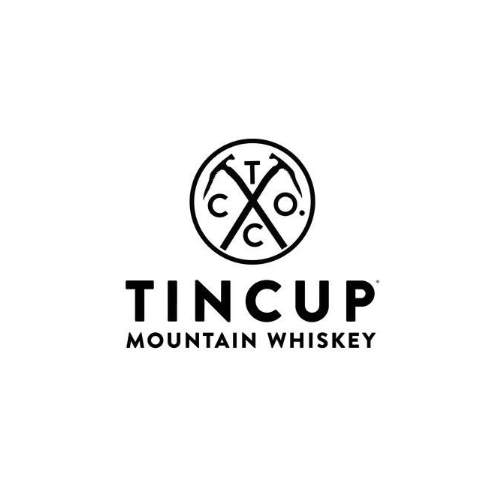 Tin Cup Mountain Whiskey logo with pickaxes and circular emblem on a black background.