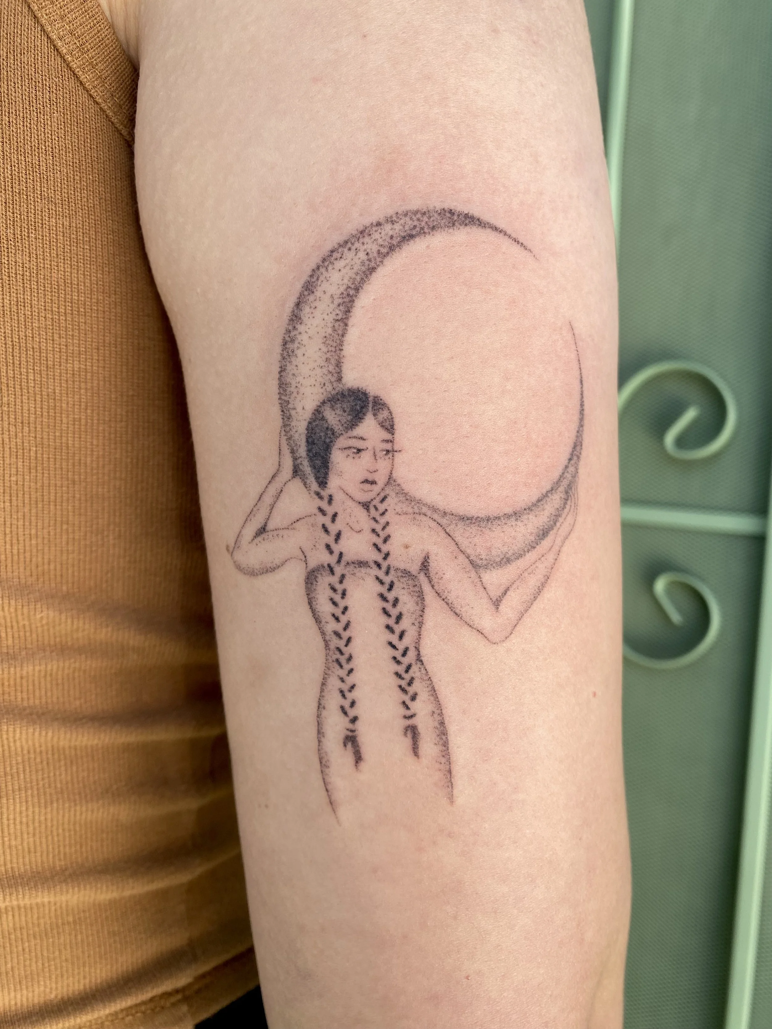 tattoo of a woman and moon