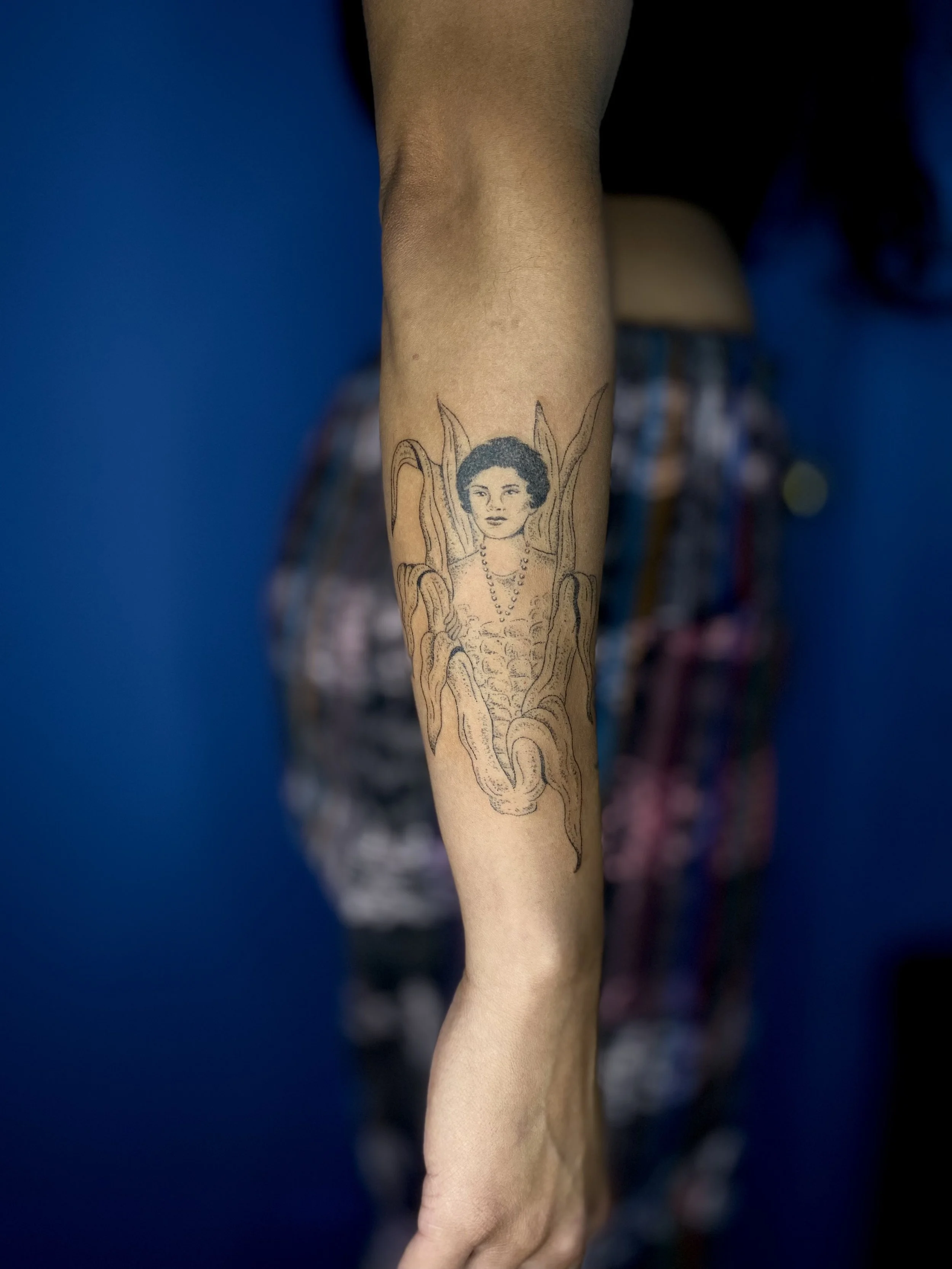 tattoo of corn becoming a woman