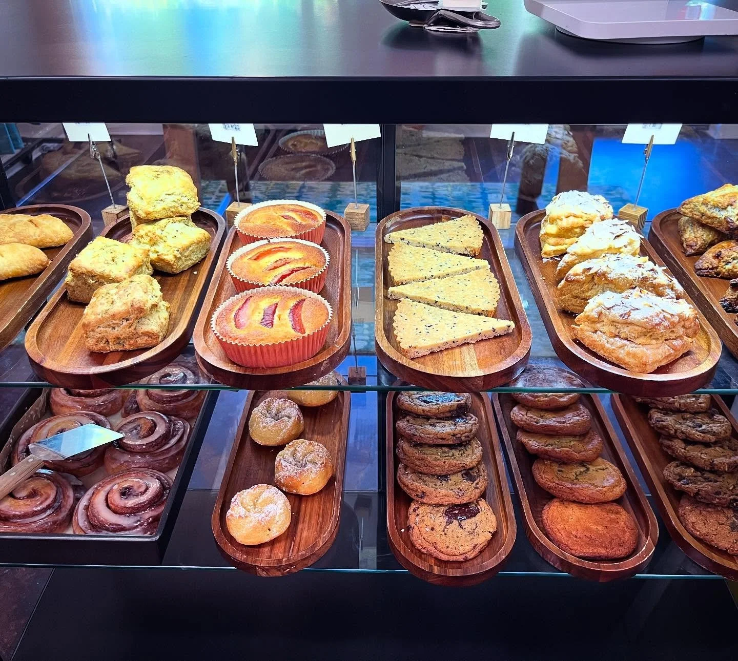 Today&rsquo;s deliciousness: caprese hand pies, za&rsquo;atar biscuits, peach corn flour cakes, black sesame shortbread, almond croissant scones, roasted plum + mandarin + cardamom scones, cinnamon rolls, tarts de Santiago (GF), brown butter chocolat