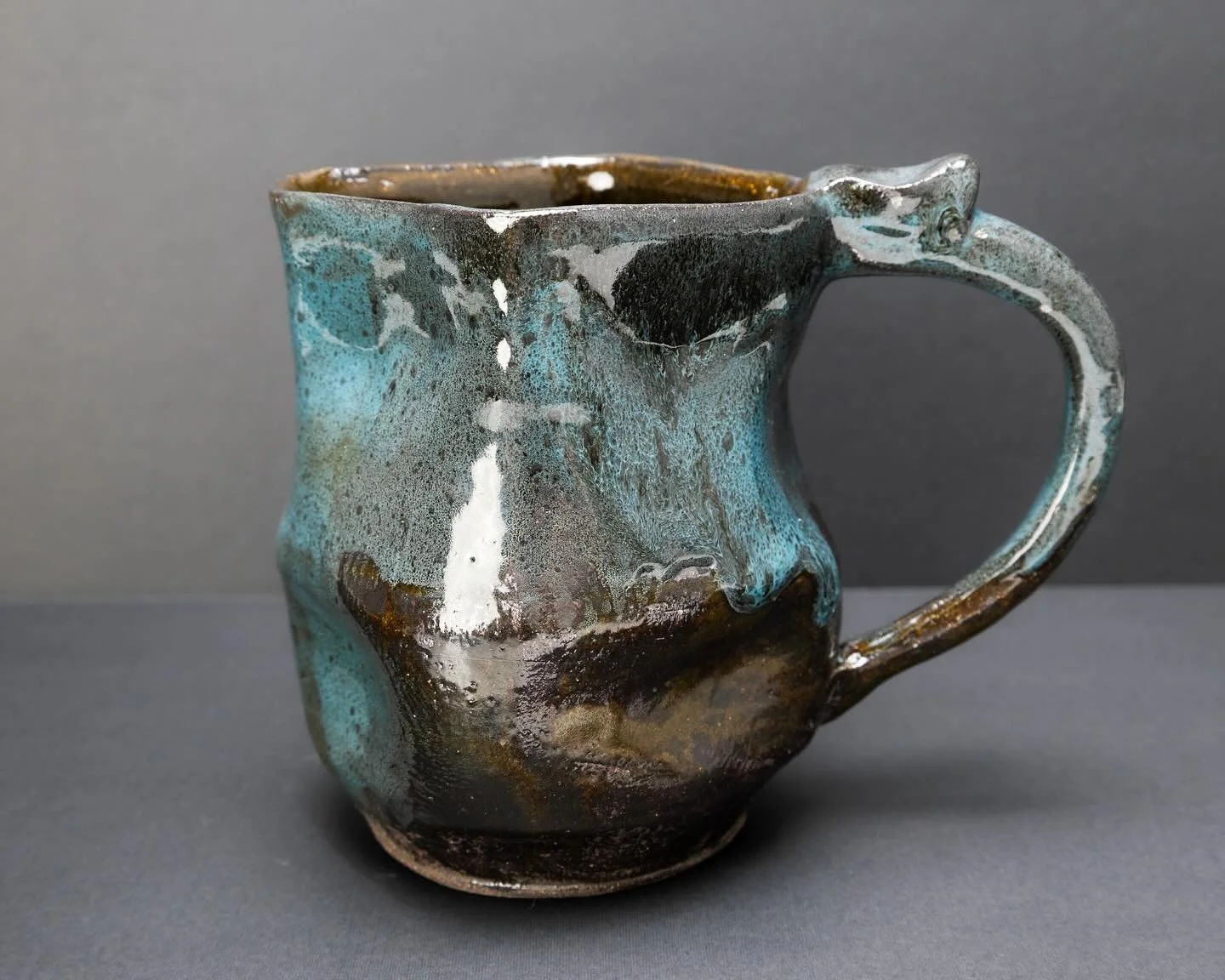 I can&rsquo;t seem to keep more than three plants alive - so I threw this smaller pitcher, altered it, and used it as a test for an oil spot glaze I&rsquo;ve been tweaking. There are a few successful moments in there if you look really close.

#glaze