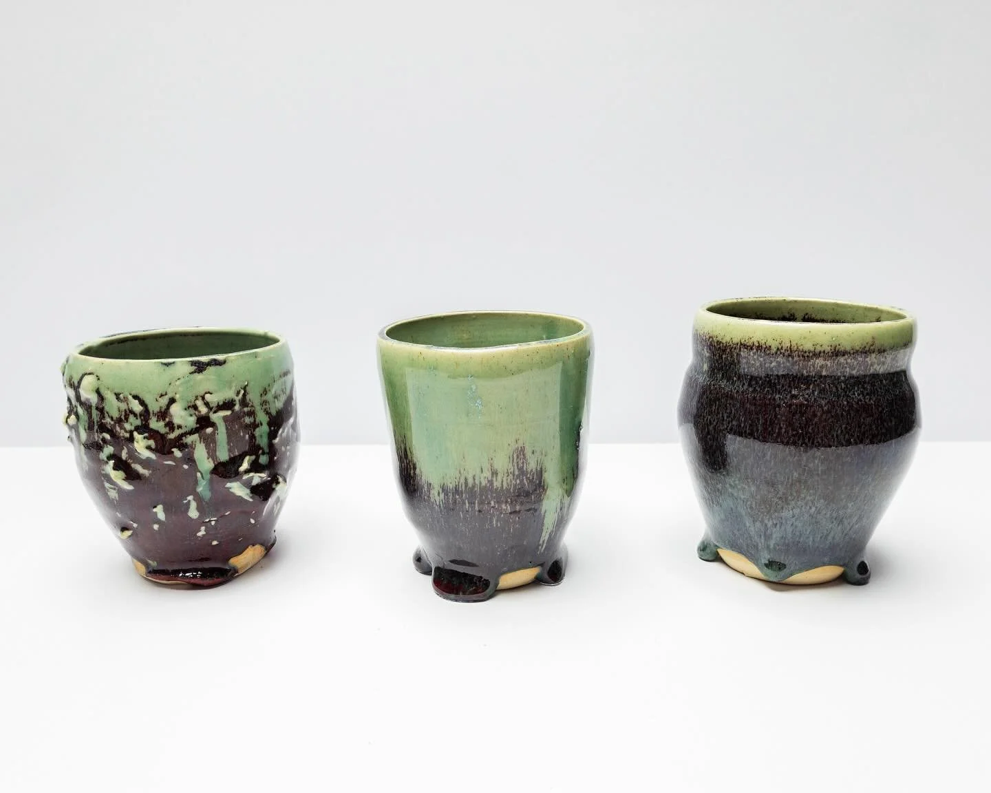 Weeks of glaze experimentation in a photo. 

Cone 6 Oxidation

Primary flux reductions, secondary flux substitutions, stabilizer adjustments, firing schedule alterations, controlled cooling adaptations, etc, etc, etc. Early to recent attempts from le