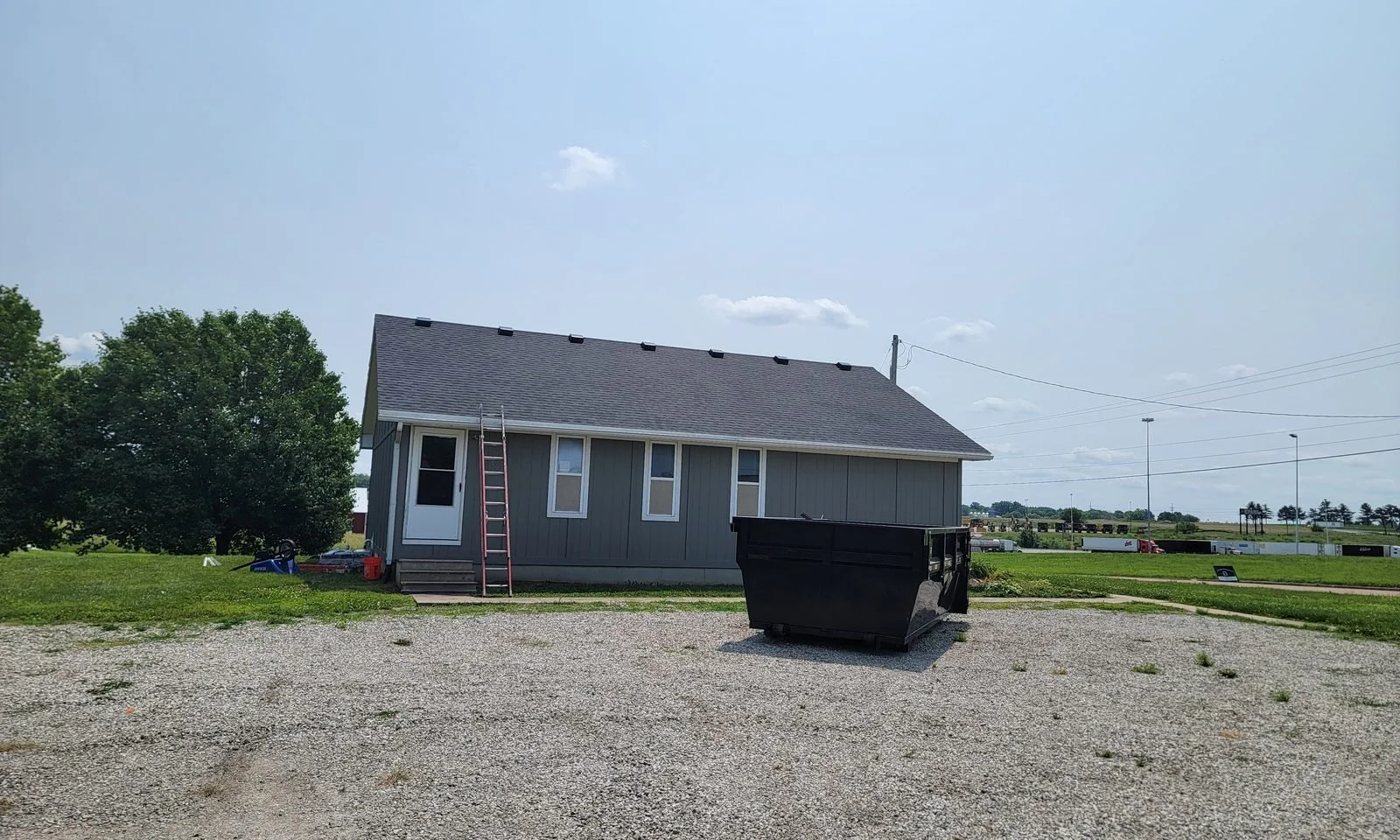 Single-story building after a completed roof replacement