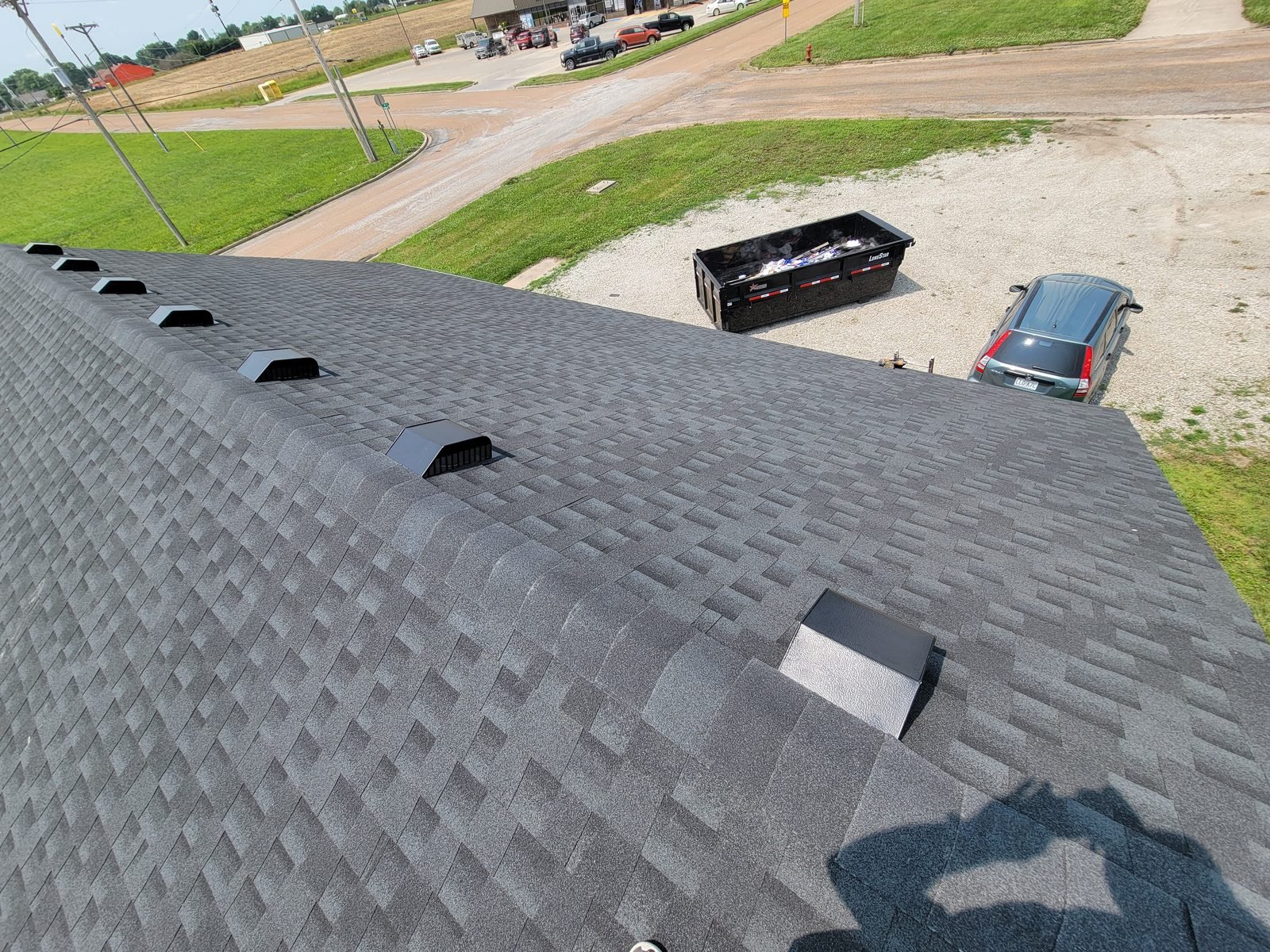 New asphalt shingle roof with roof vents and pipe flashings