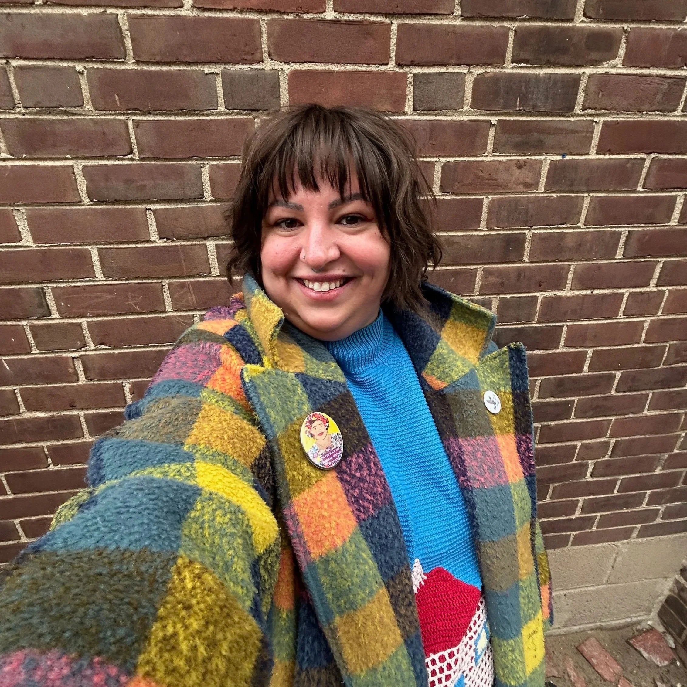 A headshot photo of Allegra Morgado.