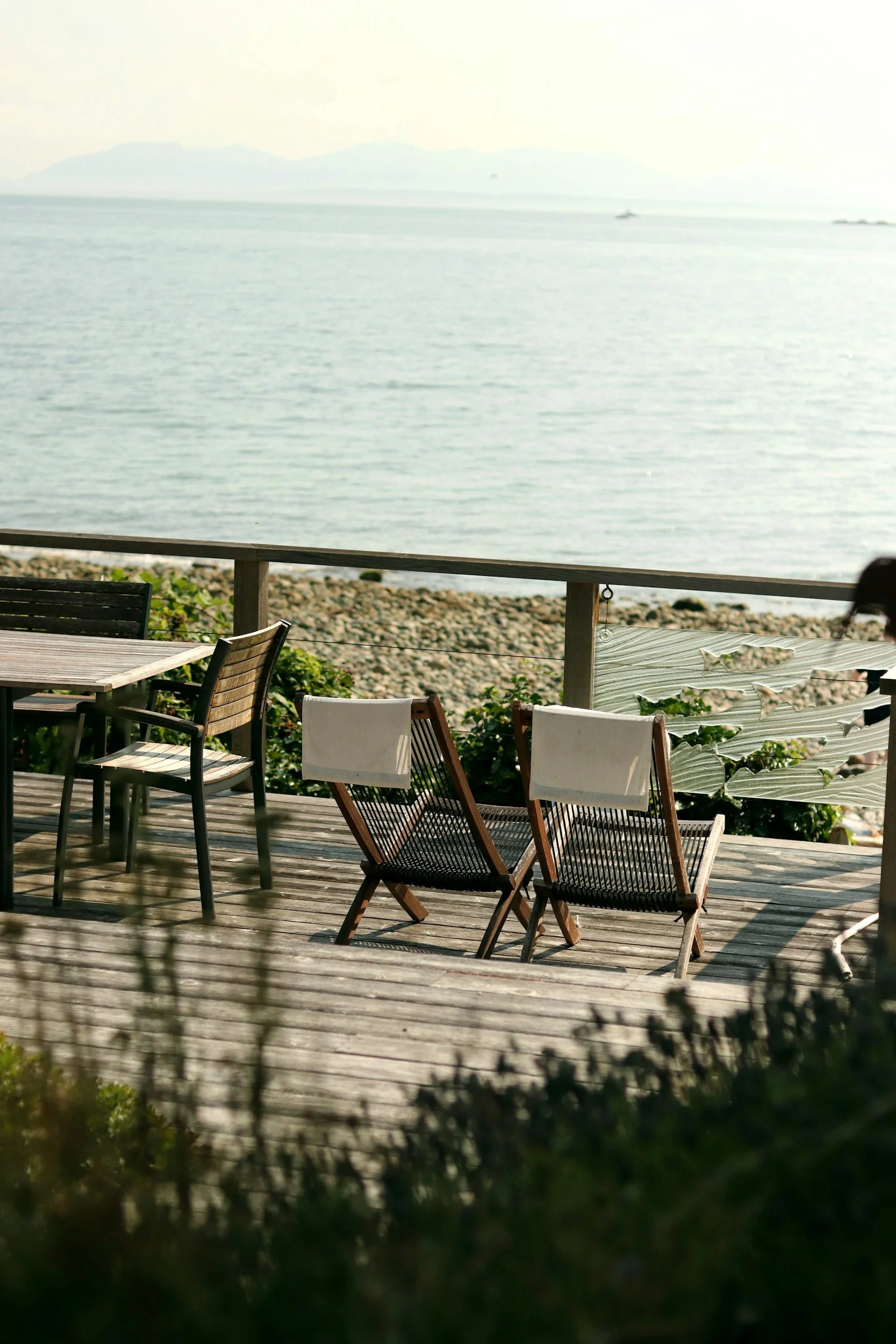 Peaceful waterfront seating area symbolizing rest, reflection, and mental health renewal.