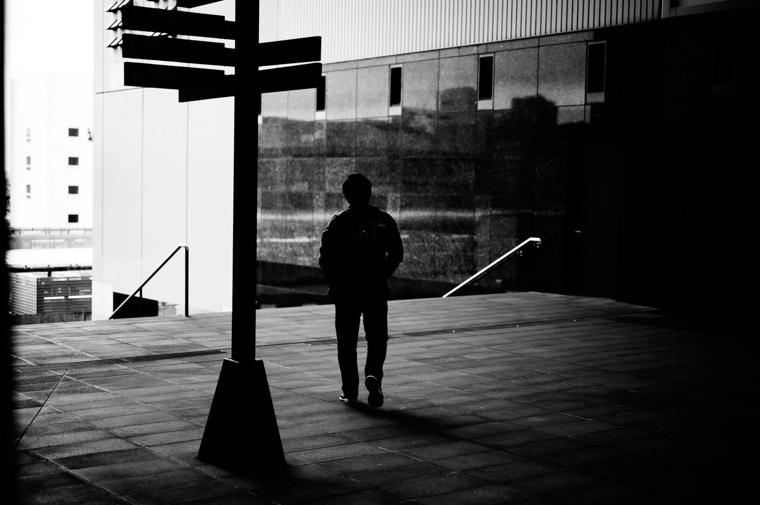Person walking alone while reflecting on recurring emotional patterns and the journey toward healing through therapy.