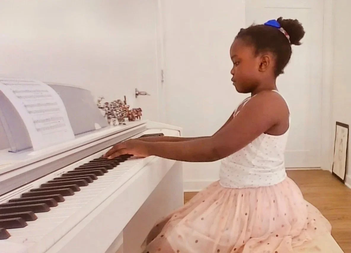 Student performing piano piece at home concert