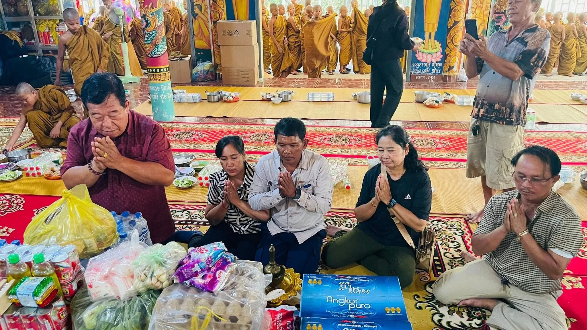 Giving donations and sponsoring the monks. Samnag Seng and community.