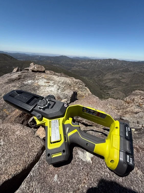 Clearing the trail to the top of Manza Benchmark