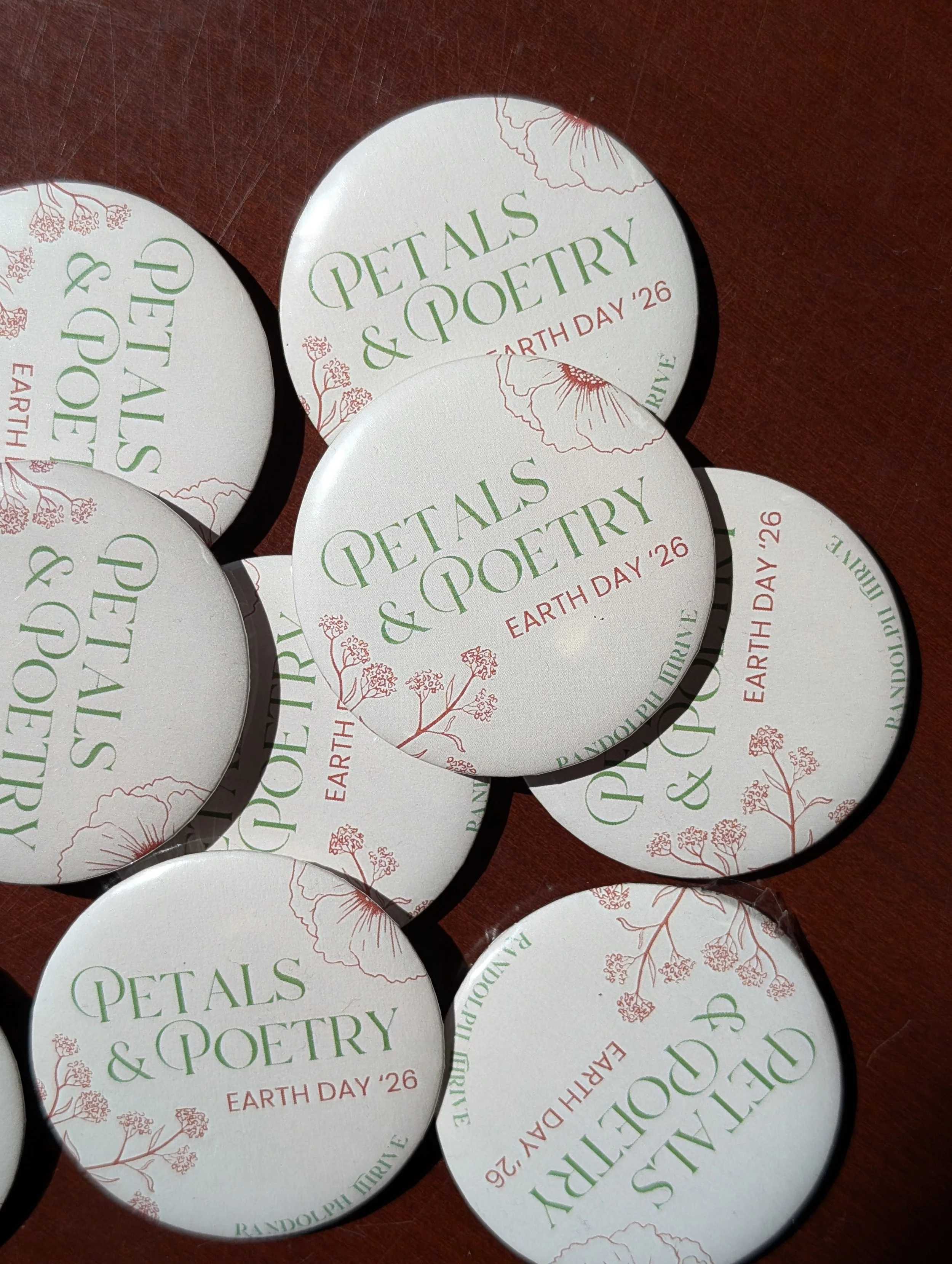 buttons that read Petals & Poetry Earth Day '26