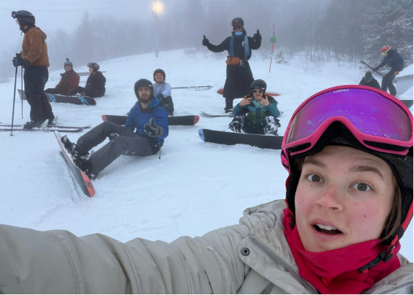students skiing and snowboarding