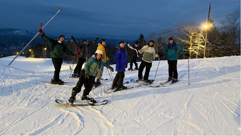 students skiiing and snowboarding on a mountain