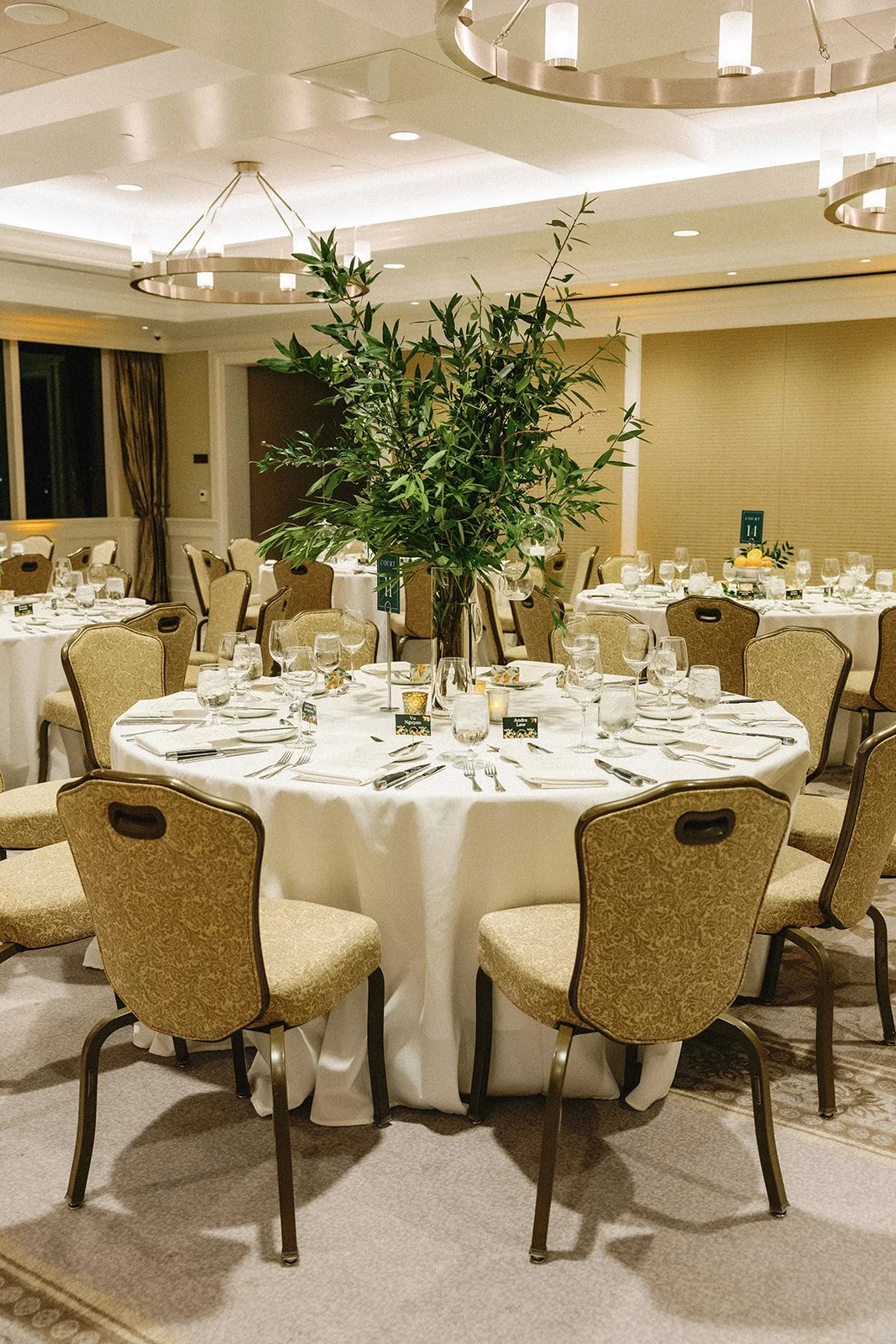 Lush green wedding centerpiece with hanging globes
