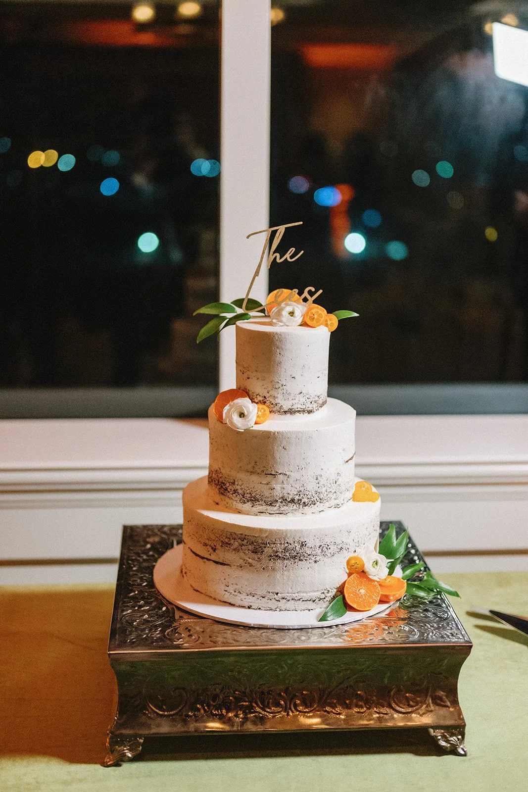 Rustic wedding cake with fresh oranges