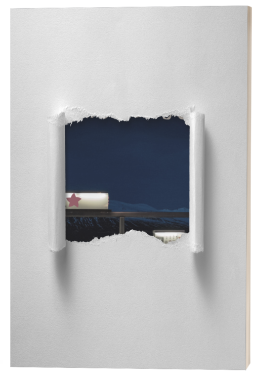 View through a ripped hole in a white wall shows a nighttime scene with mountain silhouettes and a building with a red star on the roof.