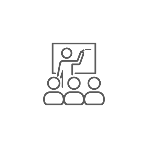 Line drawing of a teacher pointing at a blackboard with three students sitting in front teaching leadership management training.