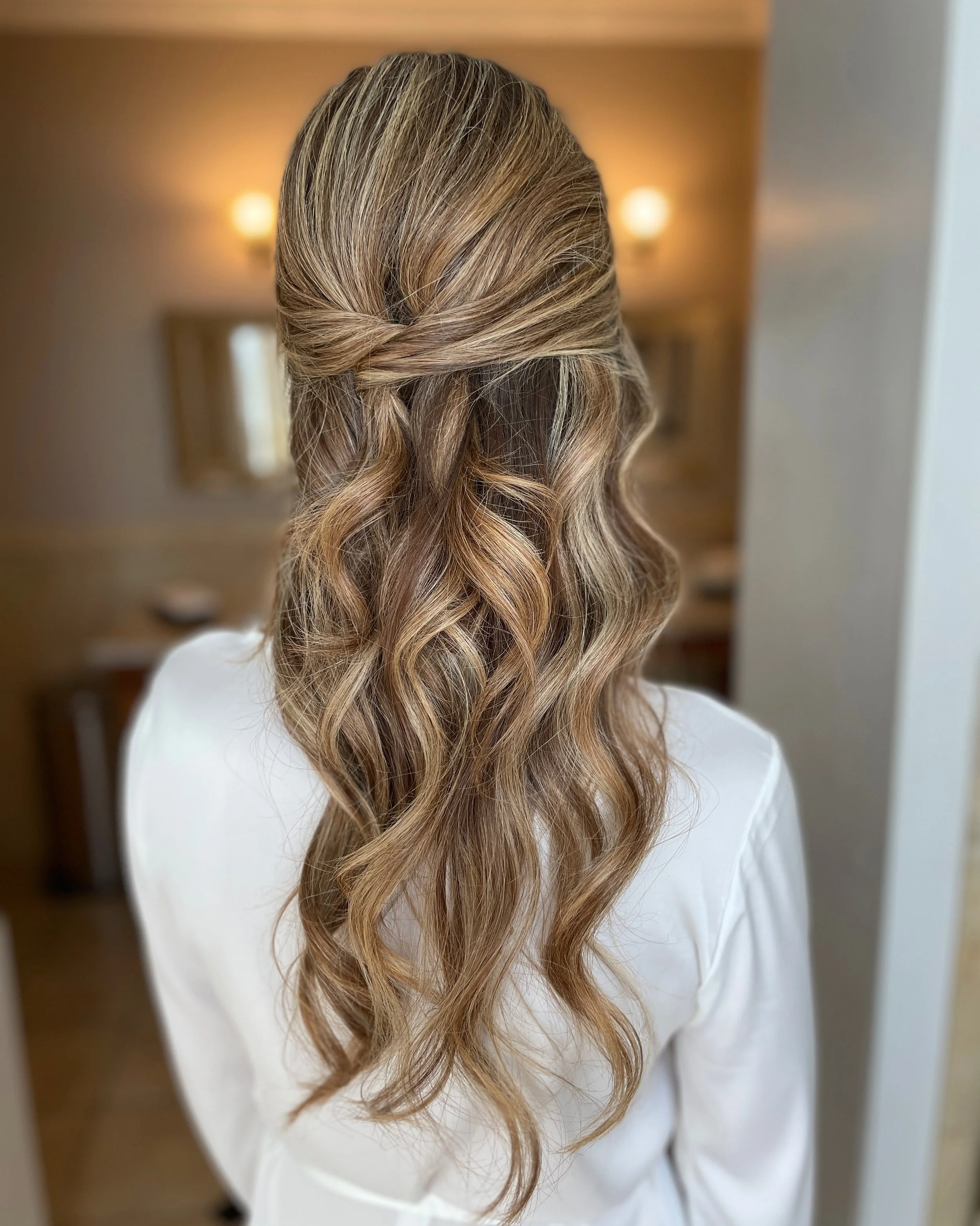 Romantic half up half down bridal hairstyle with soft curls by Frederick MD wedding hair artist