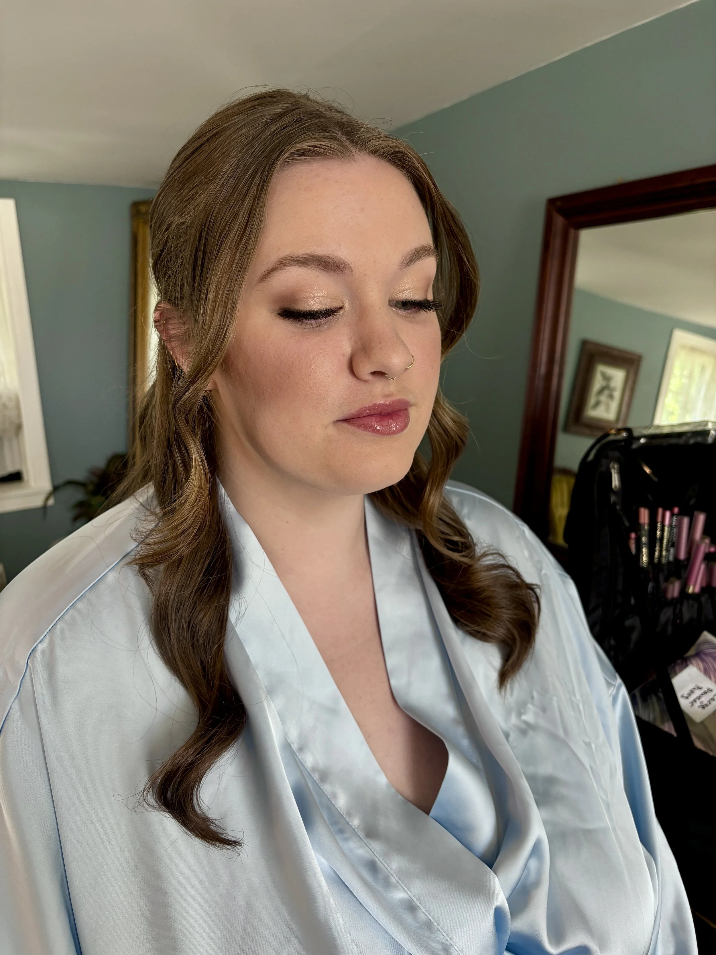 Glowing bridal beauty featuring subtle sparkle eyeshadow and soft glossed lip