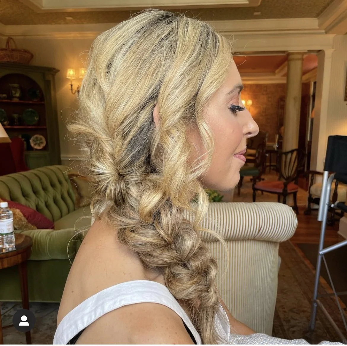 Long dimensional bridal braid styled into ponytail over the shoulder in Frederick MD