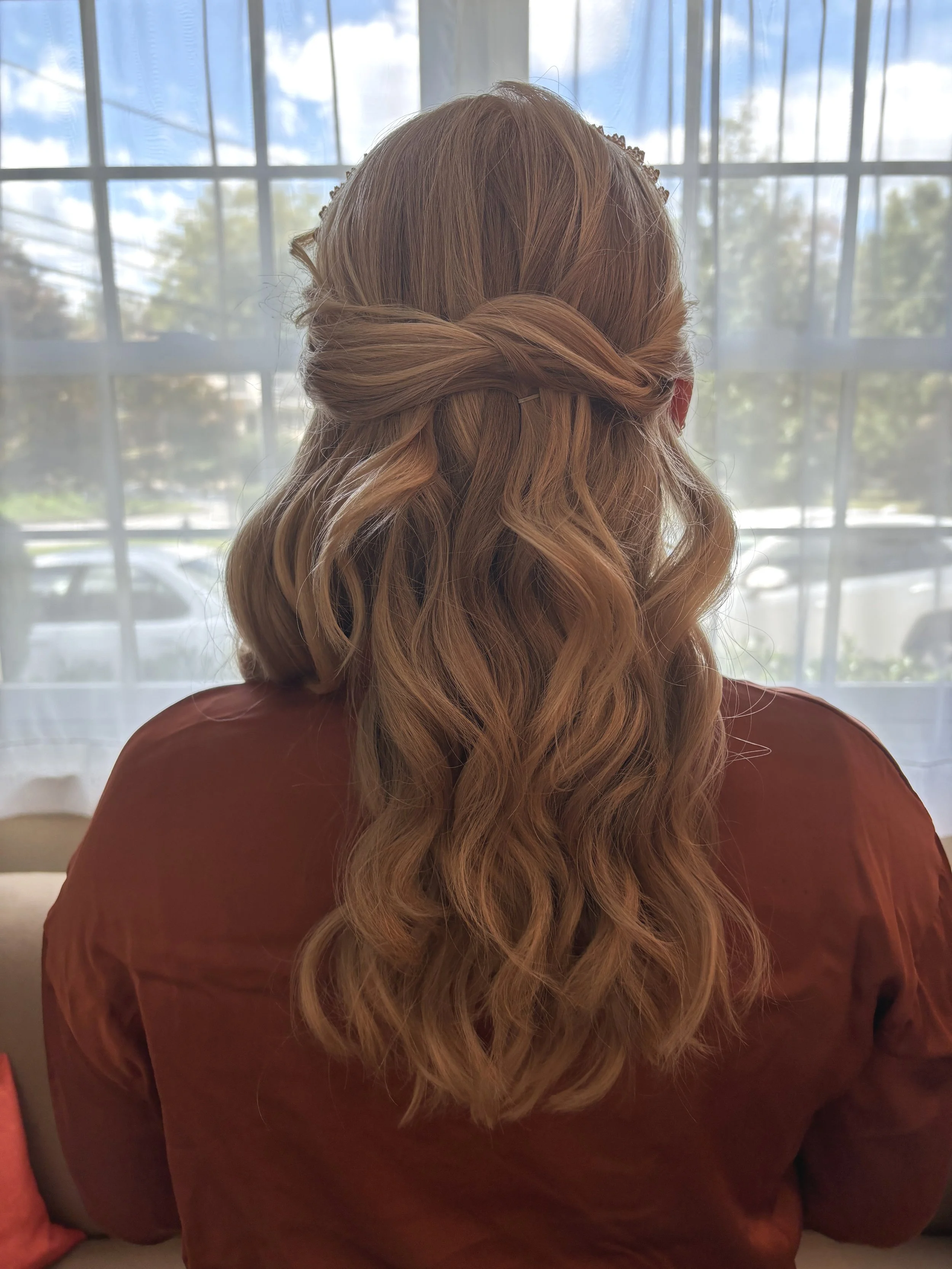 Romantic half up half down bridal hairstyle with soft curls by Frederick MD wedding hair artist