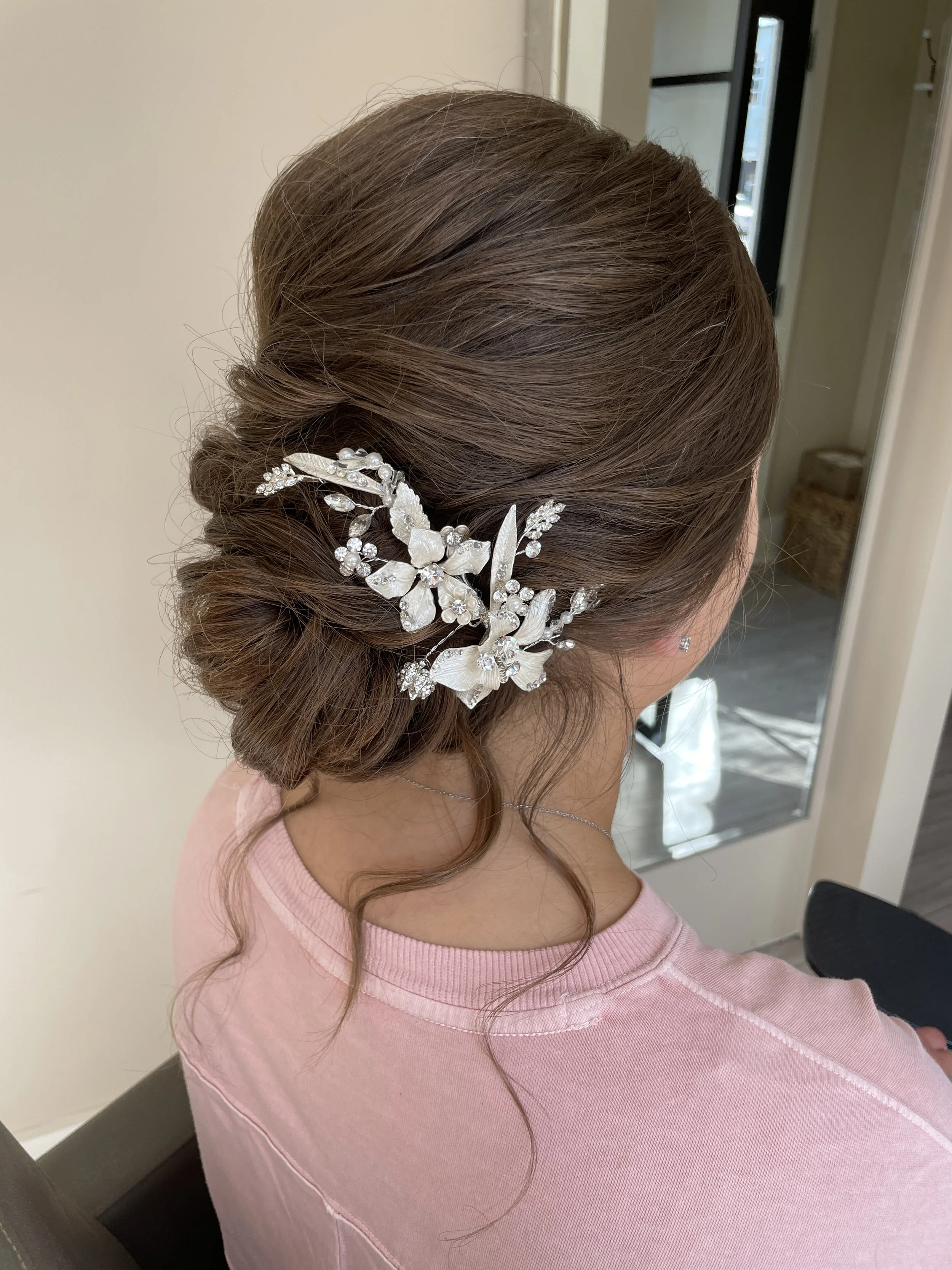 Romantic Maryland bridal hairstyle featuring soft updo and embellished hairpiece
