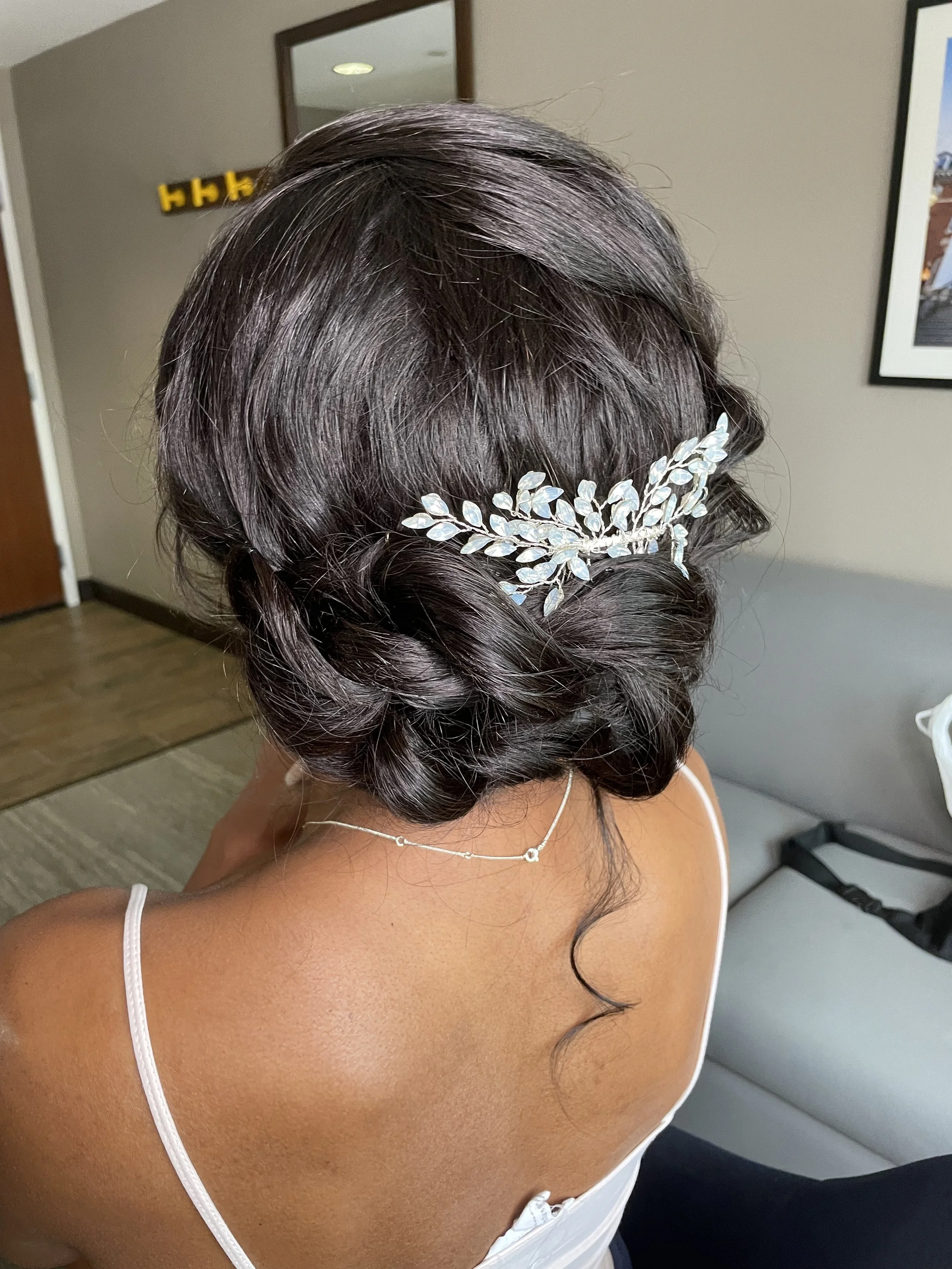 Elegant wedding updo featuring delicate hairpiece for Maryland bride
