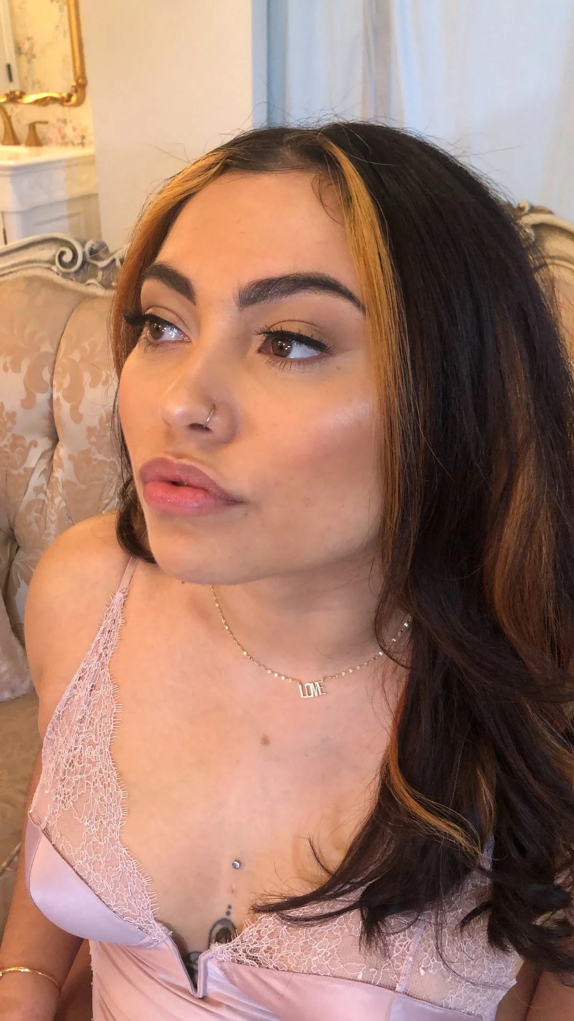 Frederick MD bridal hair and makeup stylist showcasing natural wedding makeup on a bride with nude lip, winged liner, and perfectly sculpted brows